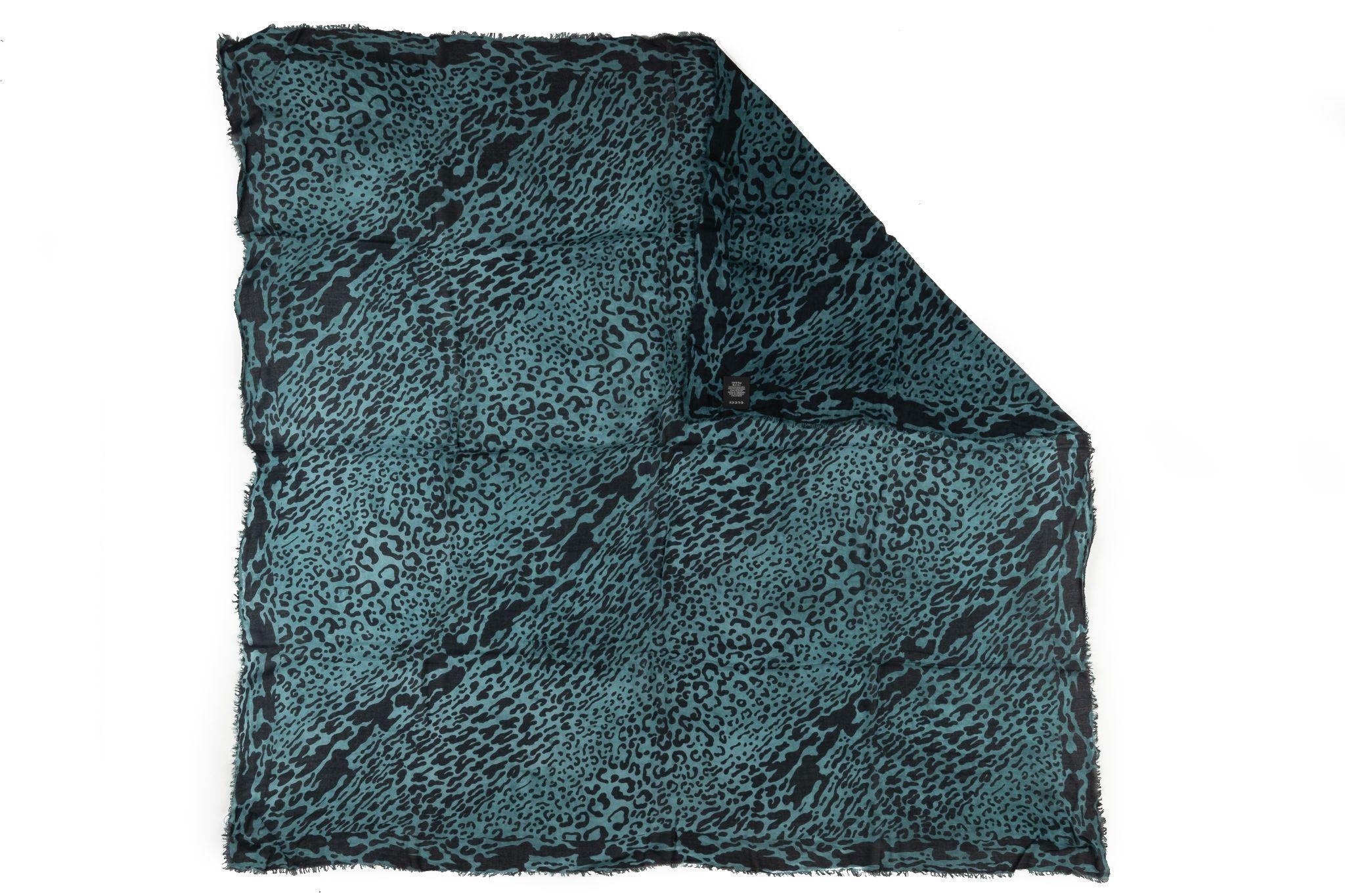 Gucci teal black cheetah print large shawl. Modal and wool combination makes up the material. Comes new with the tag!