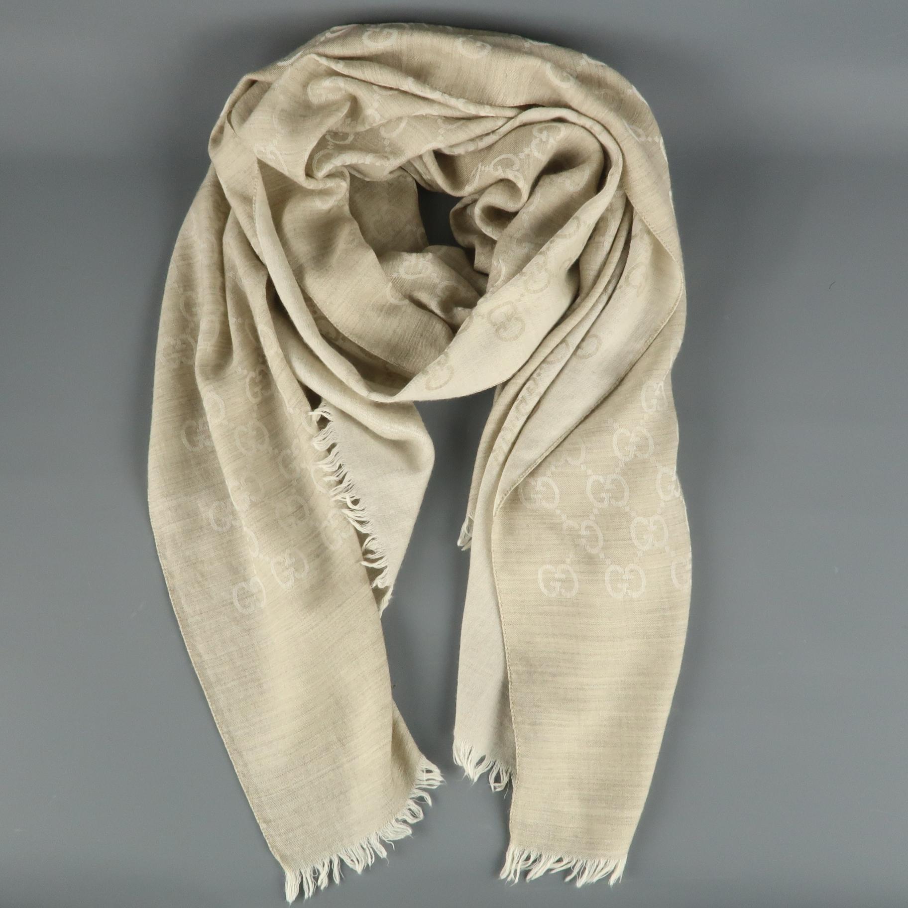 GUCCI scarf comes in oatmeal beige wool silk blend kit with Guccisima print throughout and frayed edges. Minor wear. As-is.
 
Good Pre-Owned Condition.
 
Measurements:
 
Length: 78 in
Width: 28 in.