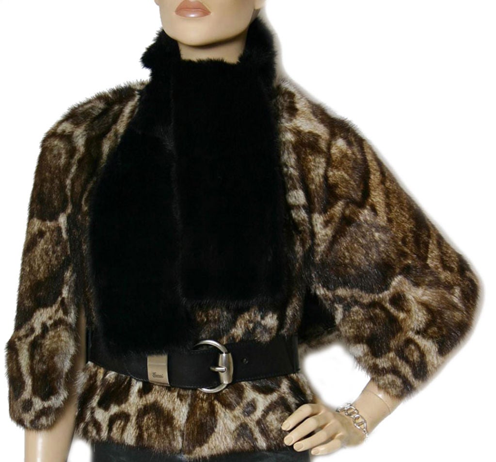 Gucci's ocelot print fur cape is a chic alternative to a winter coat

    * Genuine murmel fur
    * Attached fur scarf
    * Removable leather belt

    * Size IT 42

    The total length is 18 inches, scarf is 5 inches wide, belt is 36