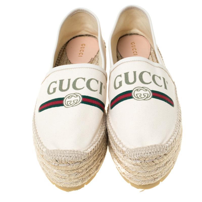 Step out in style wearing these chic espadrilles from Gucci! These off-white espadrilles are crafted from canvas and feature round toes. They have been detailed with a vintage brand logo and the signature web print on the vamps and come equipped
