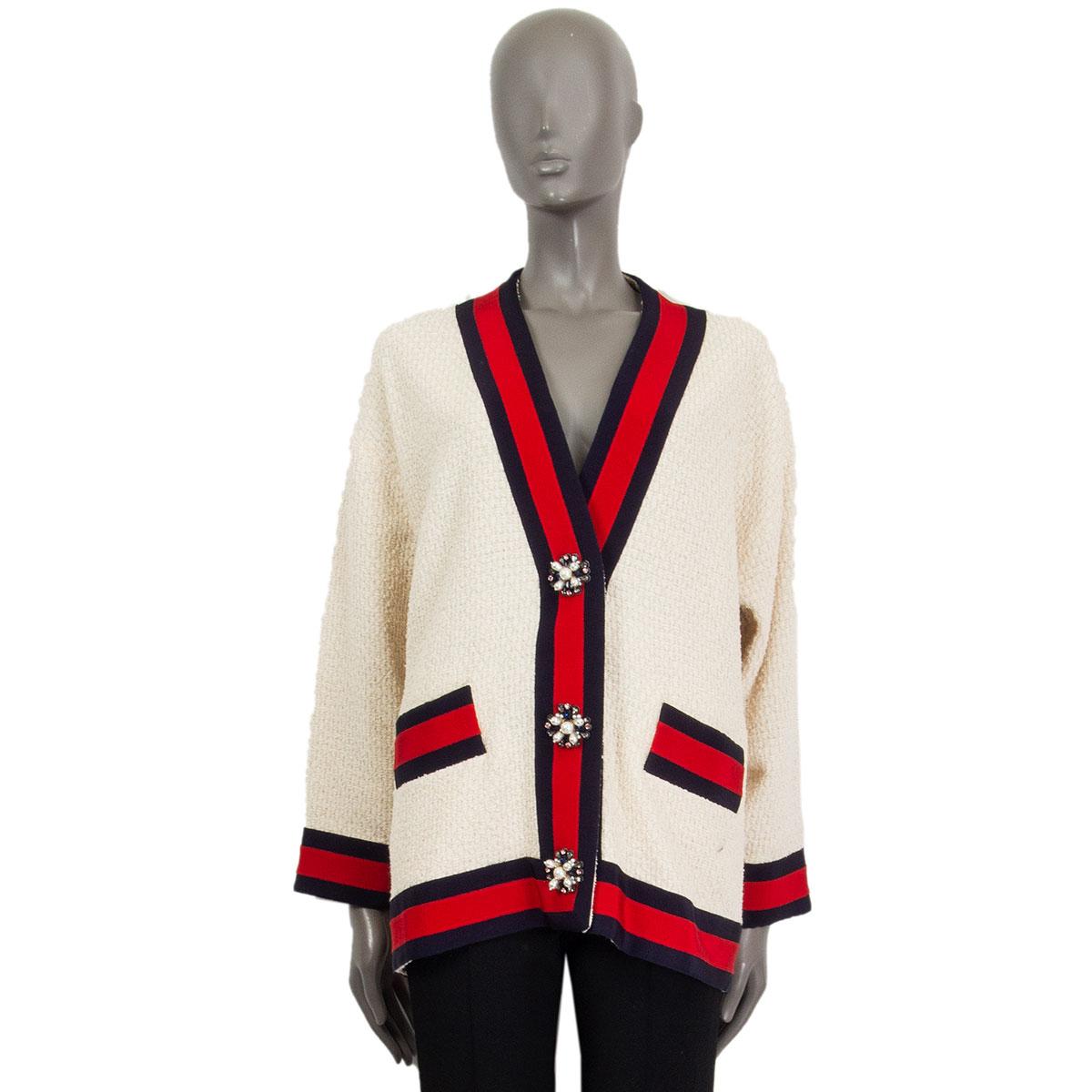 100% authentic Gucci boucle cardigan in ivory, red and navy cotton (88%) polyamide (12%). With   an oversized fit, V-neckline, ribbon hem and two pockets. Unlined. Closes with embellished faux-pearls and crystals buttons in the front. Has been worn