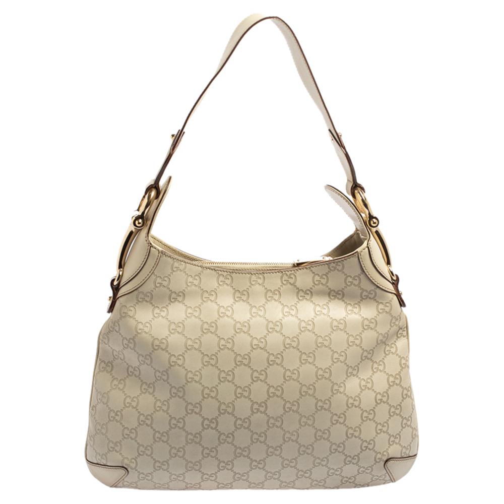 This Gucci hobo might just be your next favorite handbag. It is high in style and is functional enough to accompany you on all your busy days. The hobo comes crafted with the signature Guccissima leather and hosts a spacious canvas interior. The bag