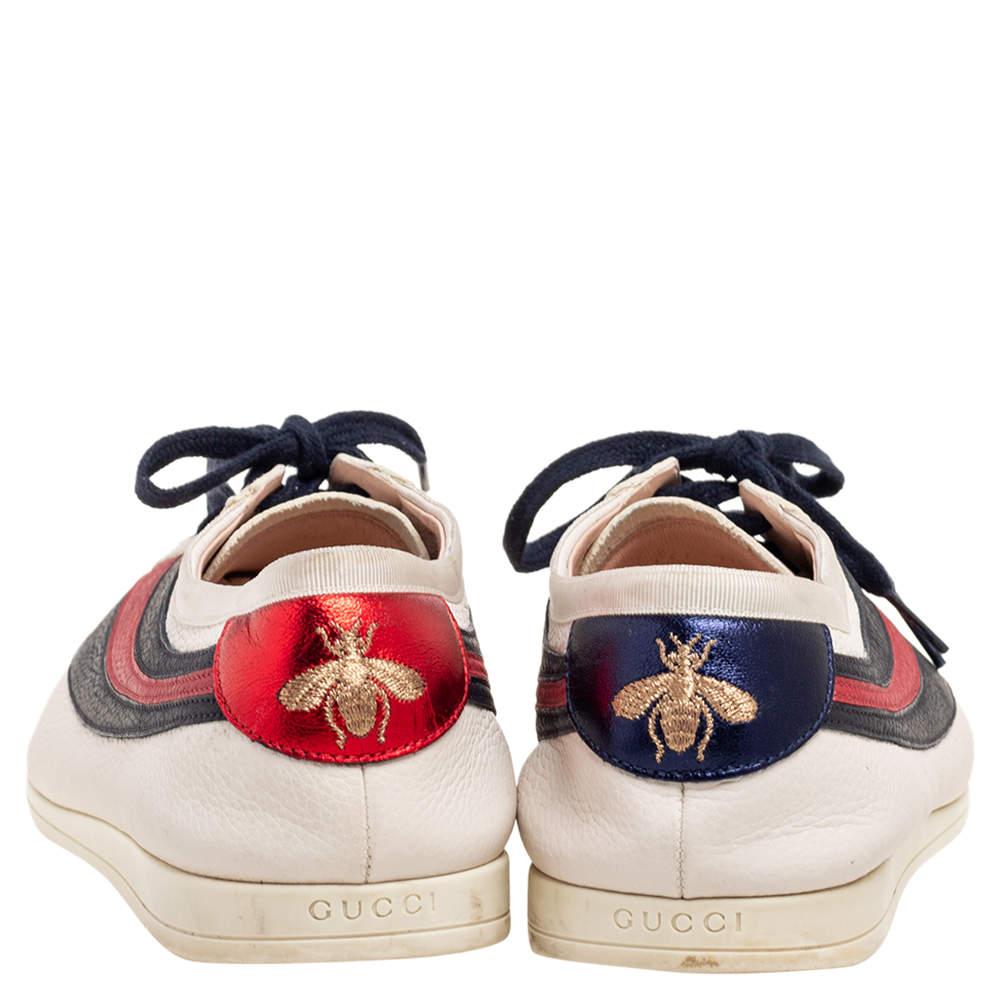 Baskets basses Gucci en cuir blanc casse avec epingle a nourrice taille 44