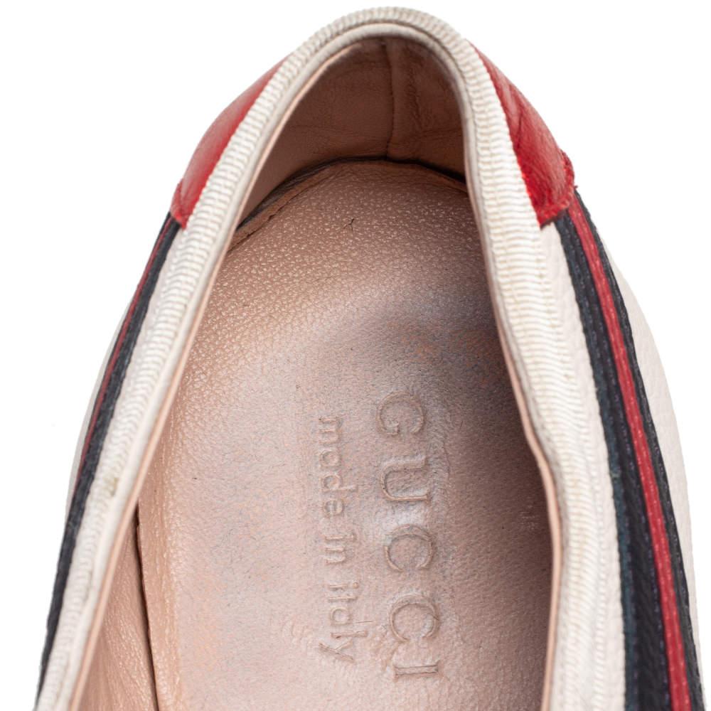 Baskets basses Gucci en cuir blanc casse avec epingle a nourrice taille 44