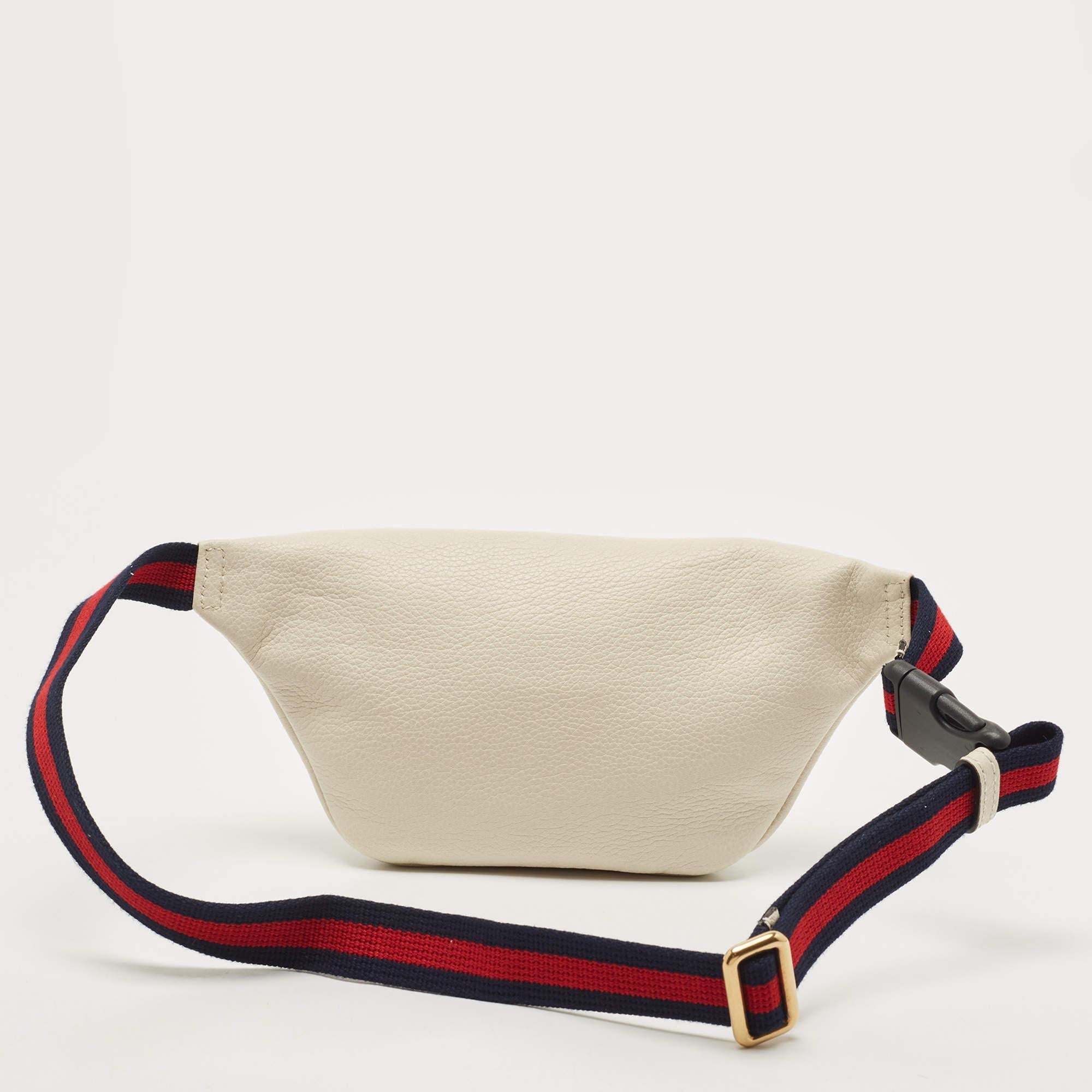 Elevated with traditional elements, this Gucci belt bag strikes the perfect balance between fashion and function. Crafted from leather, it has a statement appeal.

