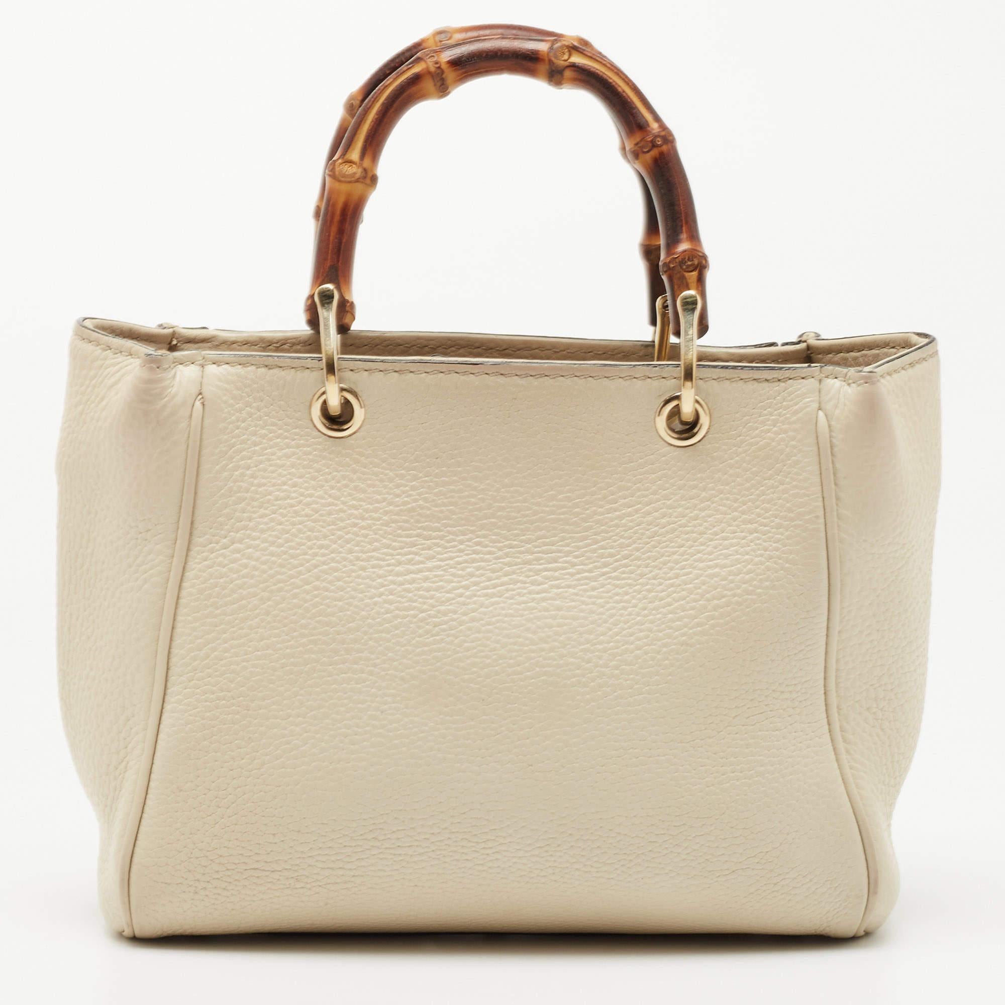 Handbags as fabulous as this one are hard to come by. So, own this gorgeous tote from Gucci today and light up your closet! Crafted from off-white leather, this tote has a spacious interior and is wonderfully held by two Bamboo handles, making the