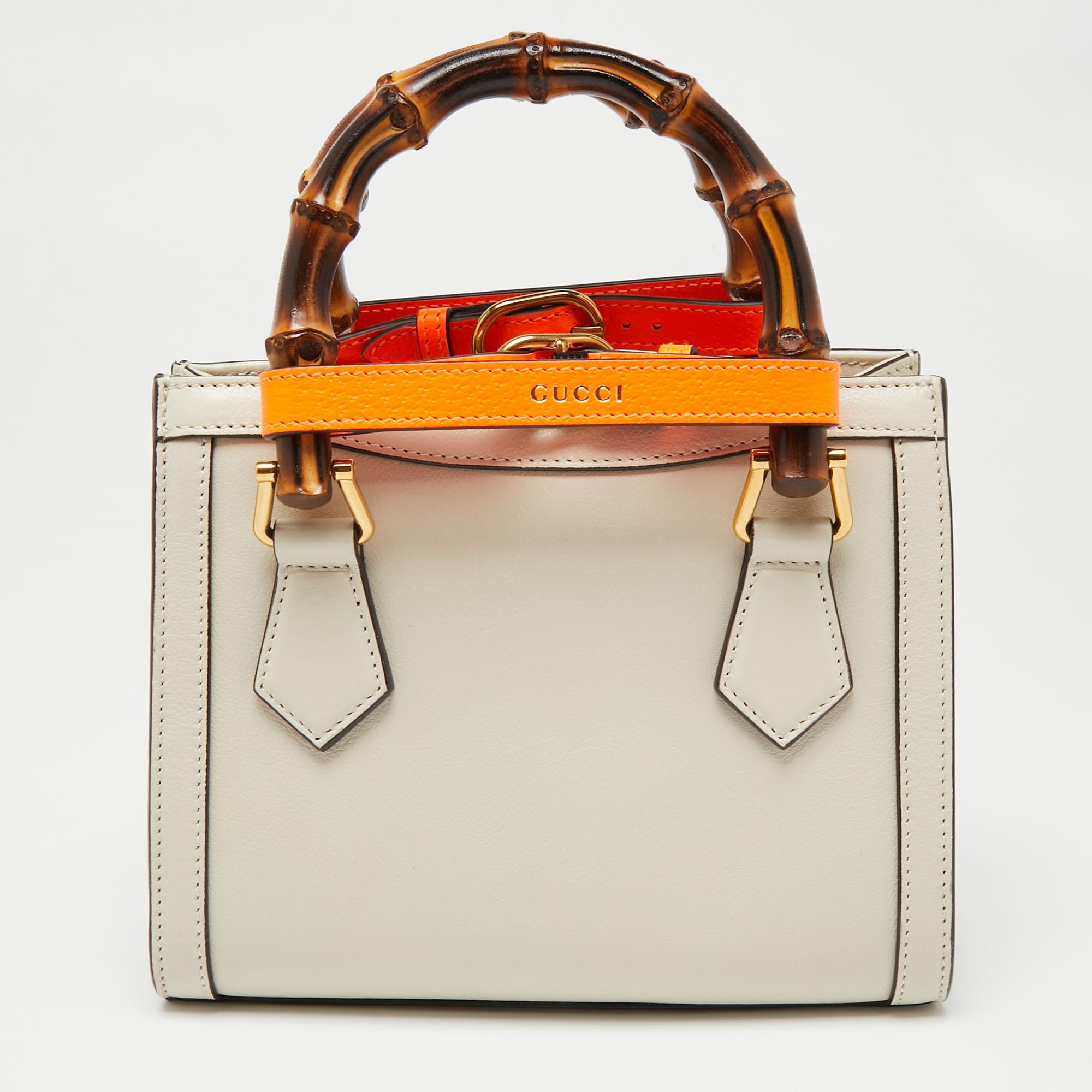 Coming from Gucci is this off-white tote that is the perfect day bag. It is crafted from leather into a structured shape and flaunts gold-tone details, dual handles, a shoulder strap, and a buttoned closure that reveals a capacious interior for your