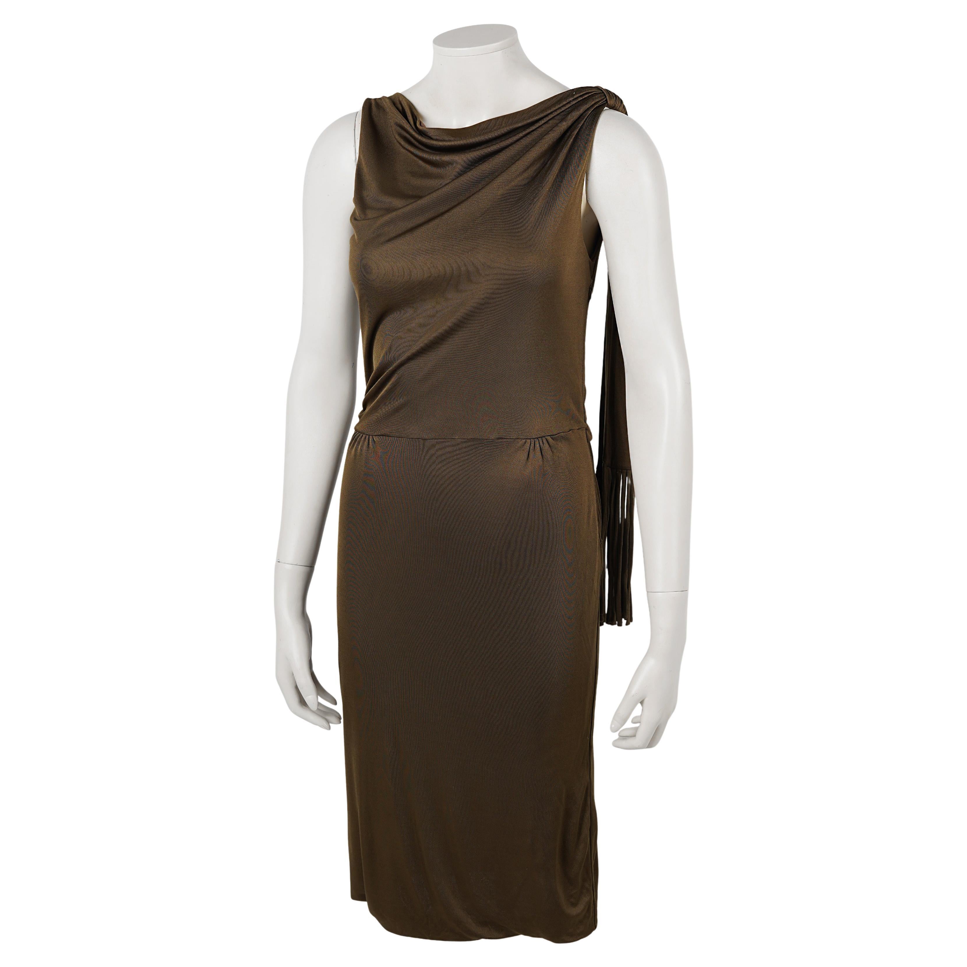This elegant Gucci evening dress from 2008 reflects the refined, modern sensuality of the Frida Giannini era, when the house embraced fluid silhouettes, subtle glamour, and a quietly confident femininity. Crafted in Italy from a softly draping,