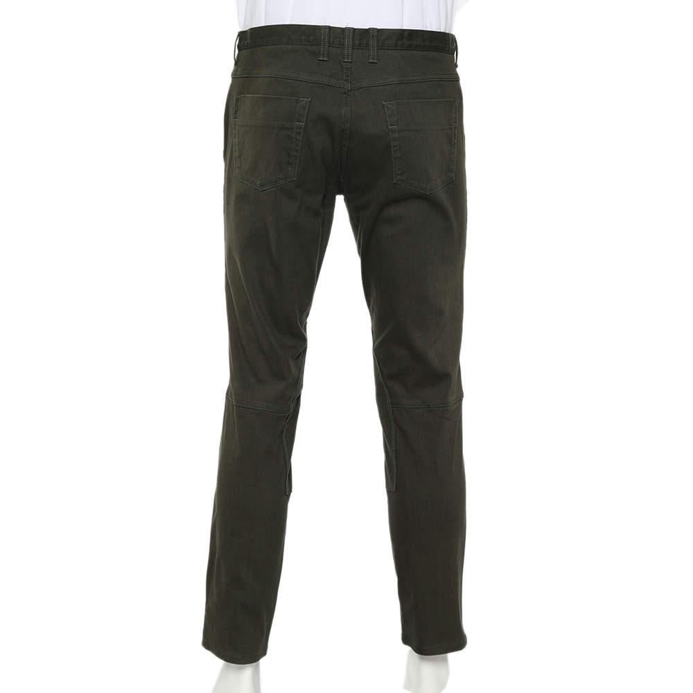 Revamp your luxury collection by adding these classy and comfy Riding jeans from the House of Gucci. They are designed from olive-green denim fabric. These jeans are equipped with a buttoned closure and five external pockets. Your attire is sure to