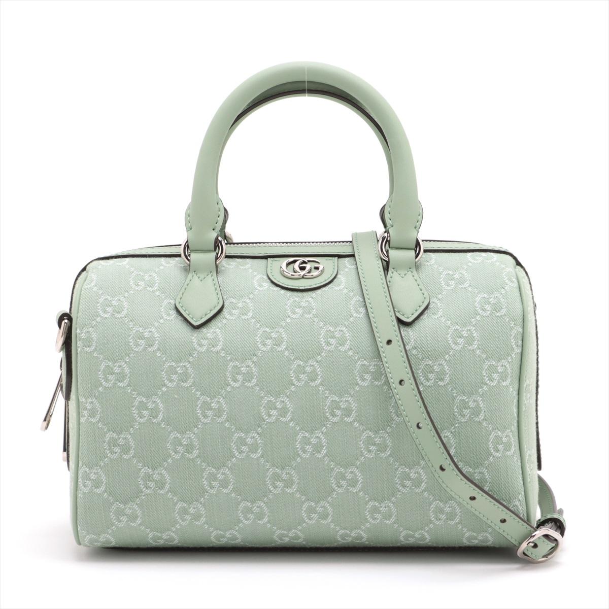 The Gucci GG Canvas Leather Two-Way Handbag in Mint Green is a chic and versatile accessory that effortlessly combines style and functionality. Crafted from Gucci's iconic GG canvas and accented with luxurious mint green leather, the handbag exudes