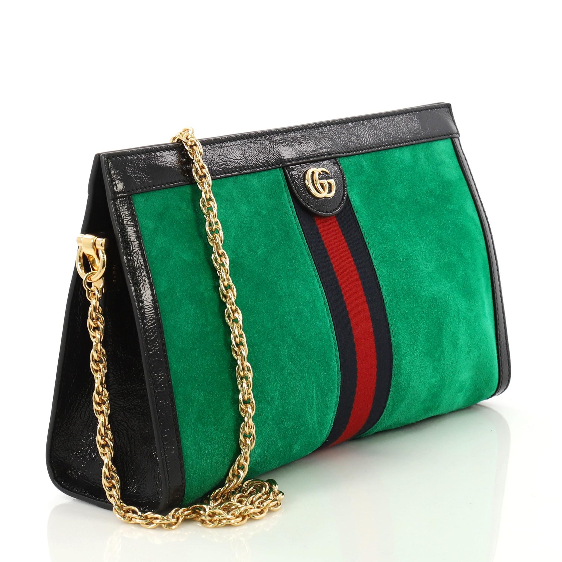 This Gucci Ophidia Chain Shoulder Bag Suede Medium, crafted in green suede, features chain link shoulder strap, web stripe detail, leather trim, Gucci logo, and gold-tone hardware. Its magnetic snap closure opens to a blue satin interior divided