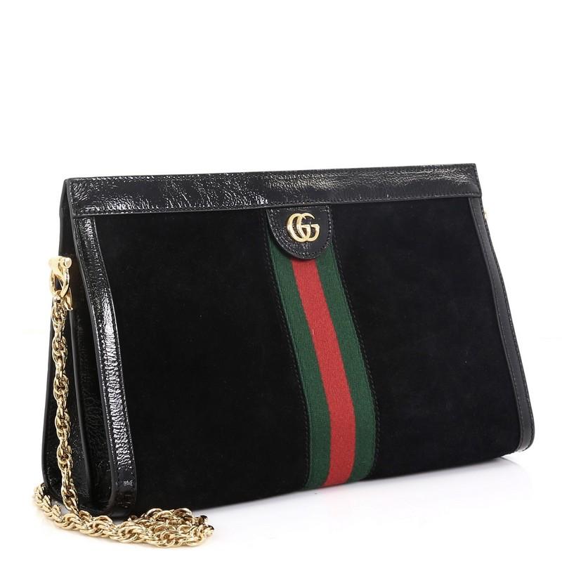 This Gucci Ophidia Chain Shoulder Bag Suede Medium, crafted in black suede, features chain link shoulder strap, web stripe detail, leather trim, and gold-tone hardware. Its magnetic snap closure opens to a blue satin interior divided into two