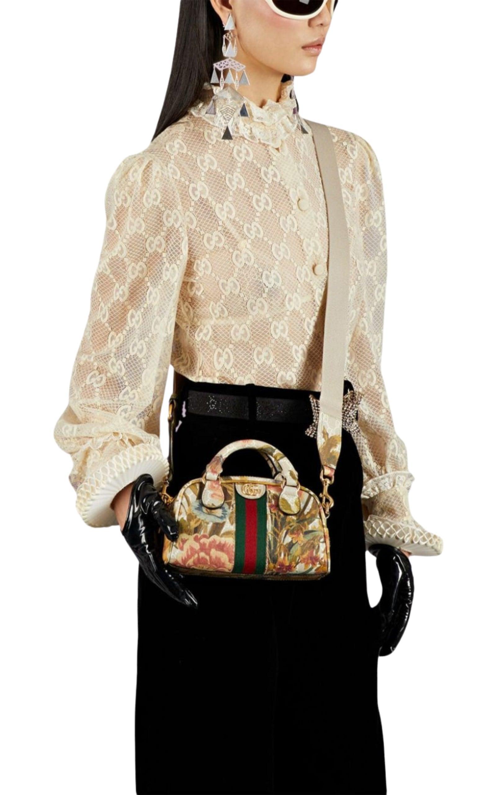 The Ophidia tote bag from Gucci showcases a romantic floral motif alongside the signature Web stripe. The design has top handles and is accented with a GG emblem.
Coated canvas body
Rolled handles
Detachable flat strap
Dual top zip closures
Interior