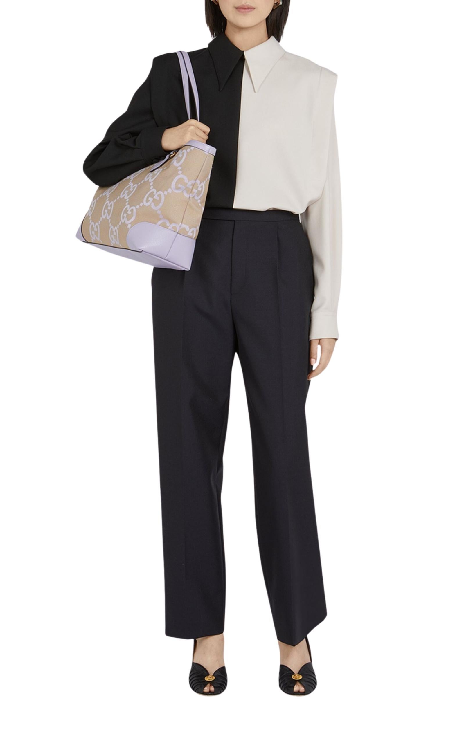 The Ophidia Jumbo GG Tote Bag style continues its evolution at Gucci, incorporating new shapes and silhouettes each season. Featuring signature elements on a practical new shape, this spacious tote is trimmed with supple leather and topped with