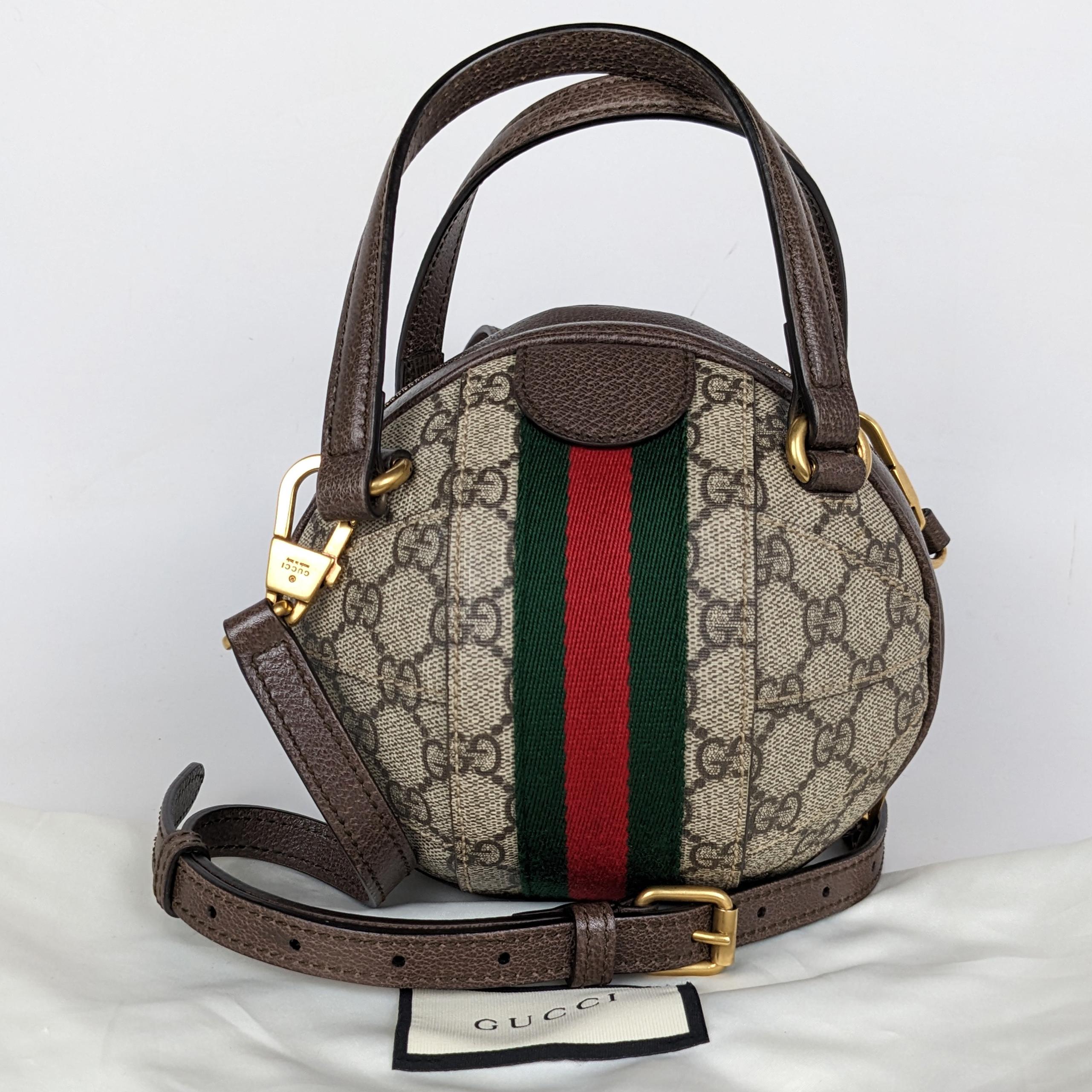 
Condition: This authentic Gucci bag is in excellent pre-loved condition. There are light scratches to the hardware and small dent on the bottom of the bag.

Includes: Dust bag, long strap

Features: Aged gold GG logo emblem on the front and an