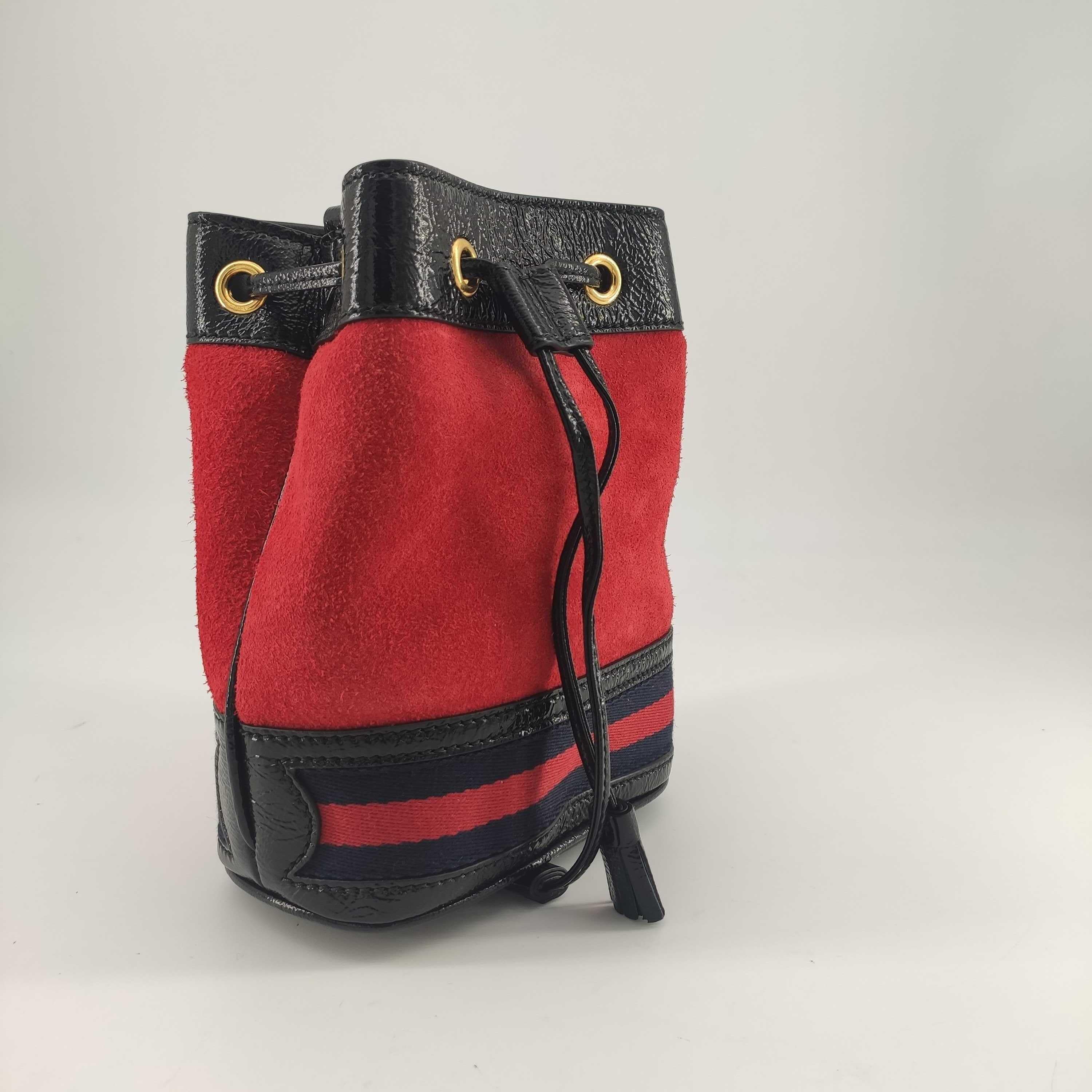 - Designer: GUCCI
- Model: Ophidia
- Condition: Never worn. 
- Accessories: Dustbag
- Measurements: Width: 16cm, Height: 19cm, Depth: 8cm
- Exterior Material: Velvet
- Exterior Color: Red
- Interior Material: Suede
- Interior Color: Beige
- Hardware