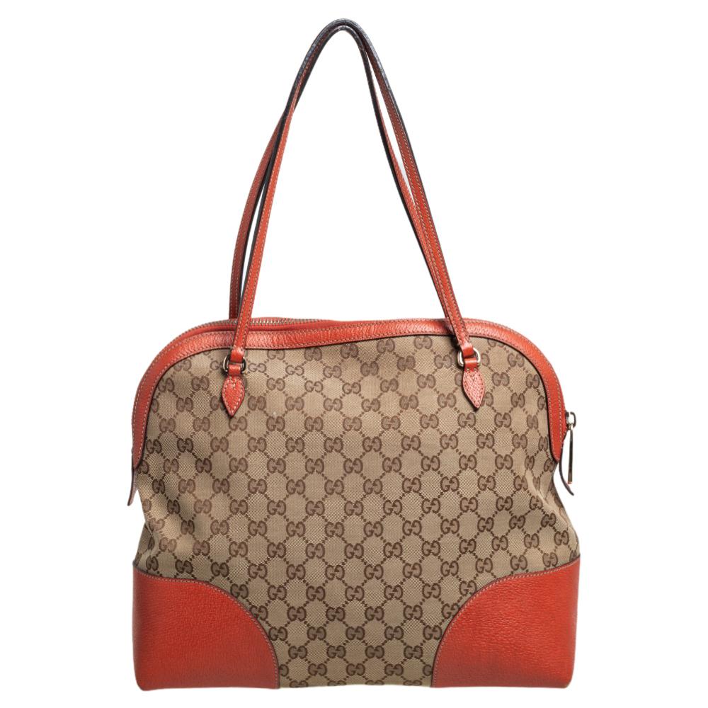 When utility meets high style, we get this Gucci Bree bag. Crafted from signature GG canvas and leather, this orange & beige bag features two shoulder handles and a spacious canvas interior to house the things you need.

