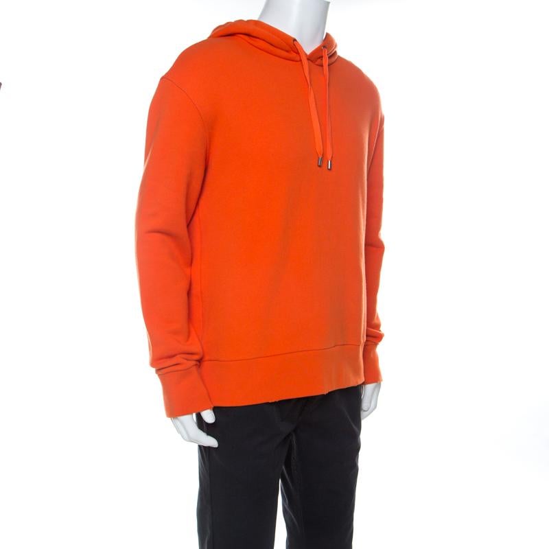 This bright orange hoodie from the house of Gucci is simple and just the right choice for your casual style. It is made from cotton and designed with a hoodie and a cool Hollywood print at the rear. This smart creation has a comfortable silhouette
