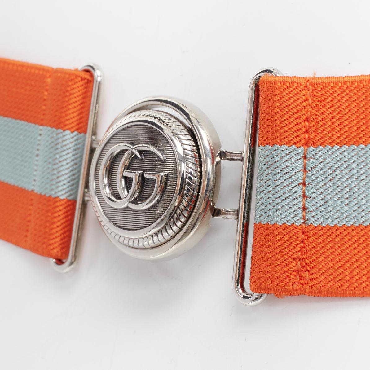GUCCI orange grey fabric webbing GG logo buckle elastic belt
Reference: AAWC/A01346
Brand: Gucci
Designer: Alessandro Michele
Material: Fabric, Metal
Color: Orange, Grey
Pattern: Striped
Closure: Elasticated
Extra Details: GG logo buckle. Elastic