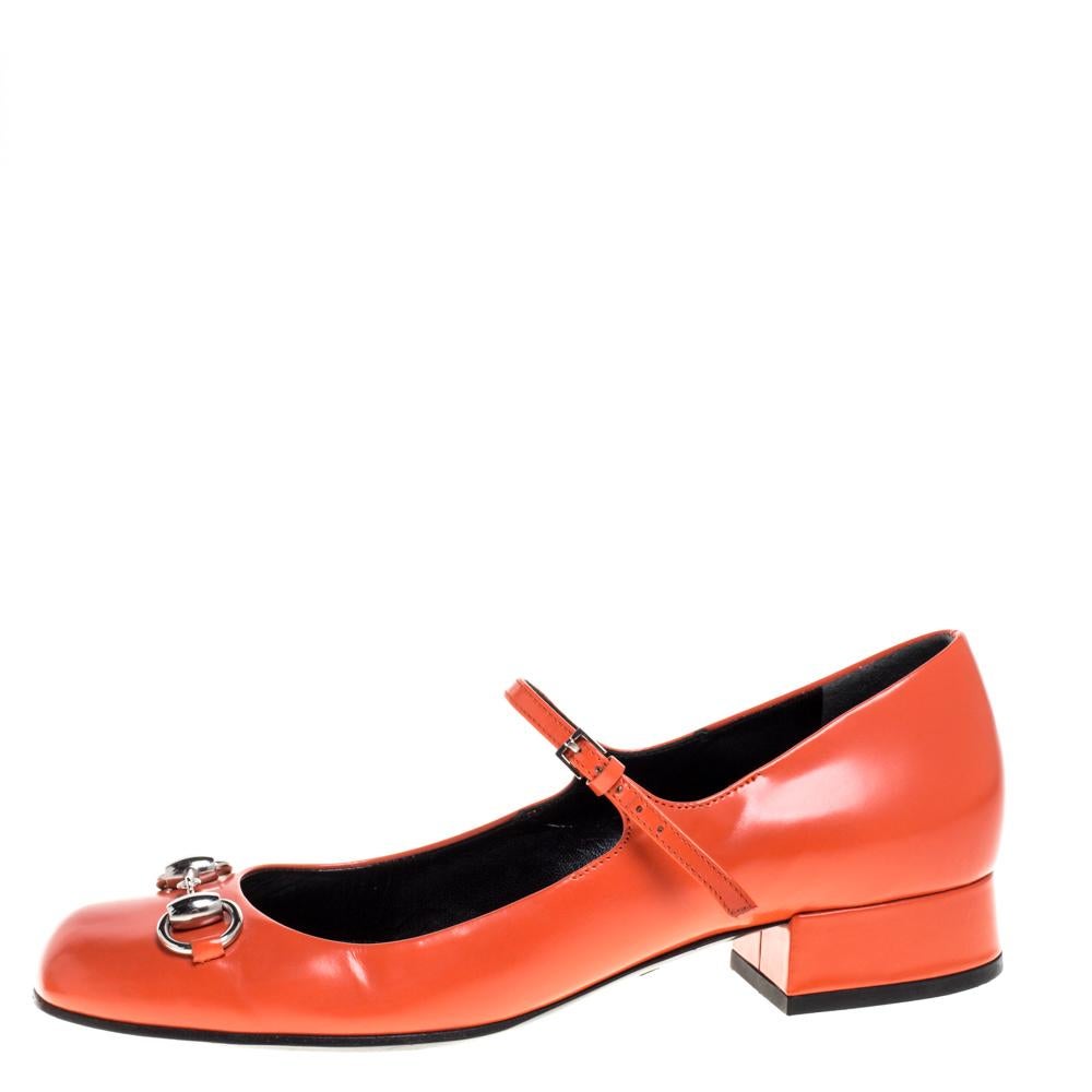 Gucci's retro Mary Jane pumps will add polish to your look. Crafted from vibrant orange leather, this pair has a sturdy small block heel and a square toe, topped with the house's signature horsebit. Style them with an A-line mini skirt to channel
