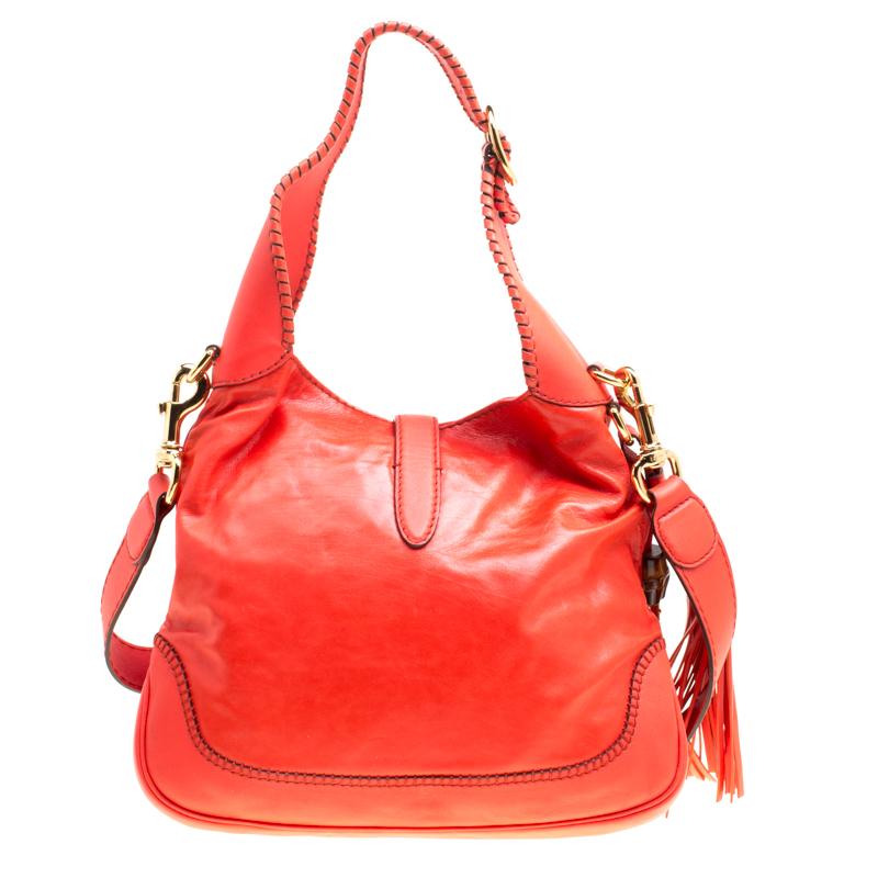 A handbag should not only be good-looking but also durable, just like this lovely orange New Jackie bag from Gucci. Crafted from leather in Italy, this gorgeous number has the signature closure that opens up to a spacious nylon interior. Complete