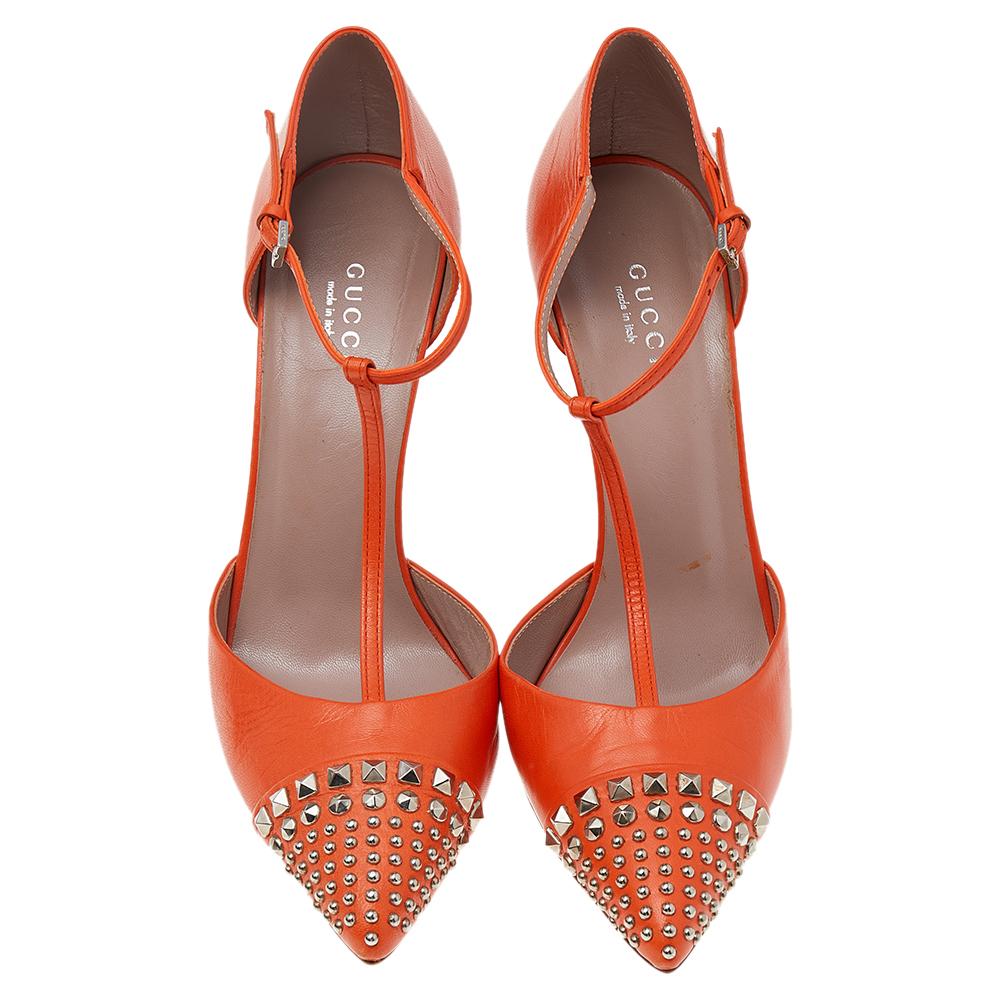 Add a hint of orange with these Coline pumps and instantly brighten up your outfit. These pumps from Gucci are crafted using orange leather on the exterior and feature pointed-toes that are augmented by delicate studded embellishments. They