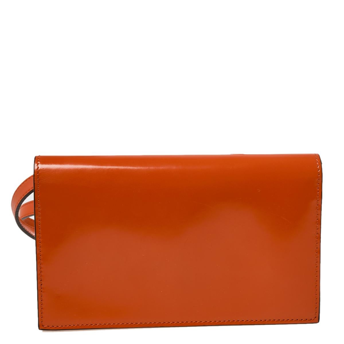 Coming from Gucci, this clutch bag will showcase your fashion-forward choice. Presenting a lovely shade of orange and the GG logo on the front flap, this bag proves to be an impeccable and contemporary addition to your closet.

Includes: Original
