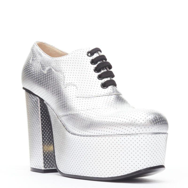 GUCCI Otis metallic silver chunky platform block heel bootie mule EU37.5
Reference: TGAS/B01669
Brand: Gucci
Designer: Alessandro Michele
Model: Otis platform
Collection: Runway
Material: Leather
Color: Silver
Pattern: Solid
Lining:  Leather
Extra