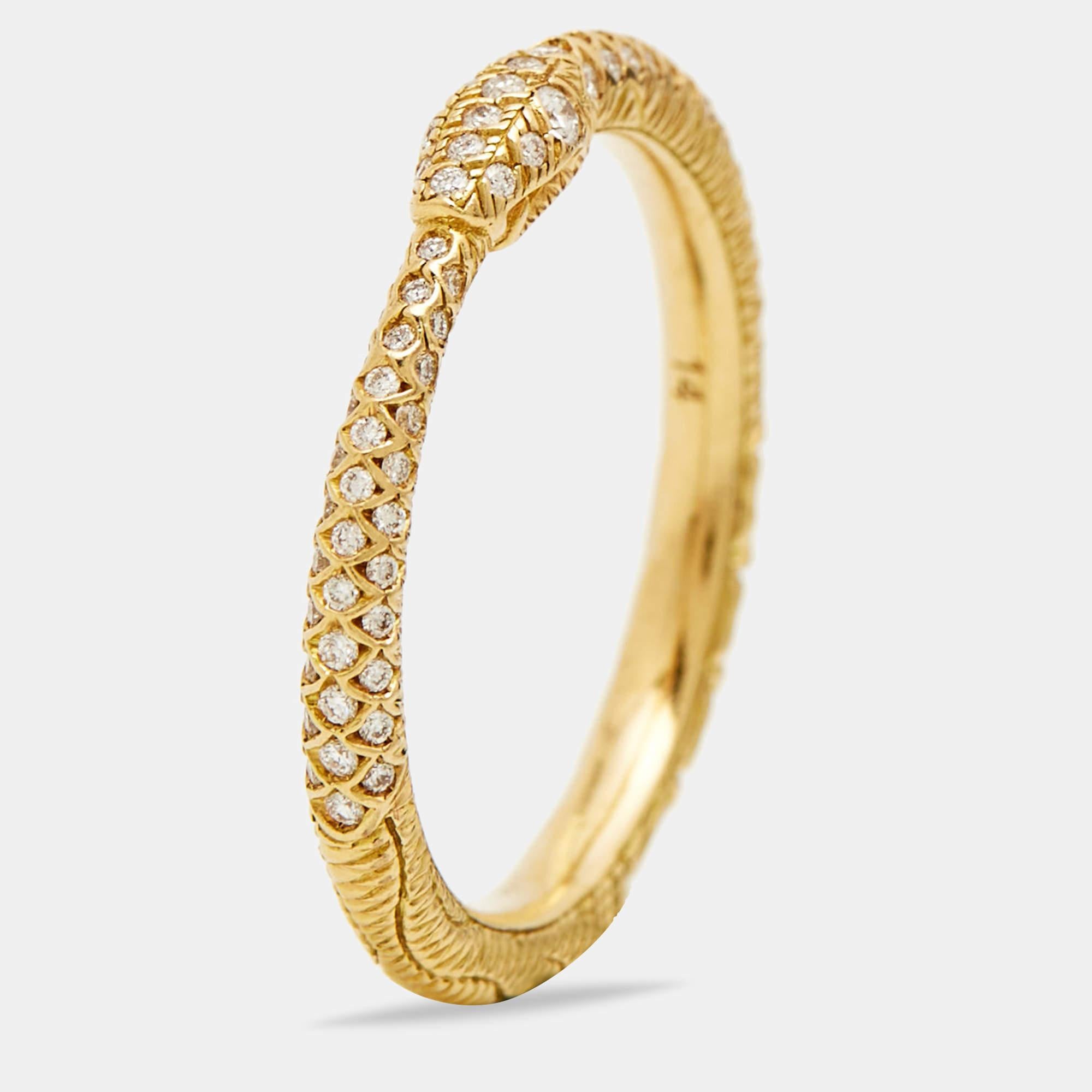 The Gucci Ouroboros ring is an exquisite and luxurious piece of jewelry. Crafted from gleaming 18k yellow gold, the ring features a captivating Ouroboros serpent design encrusted with an array of diamonds, adding a burst of shine to its elegant