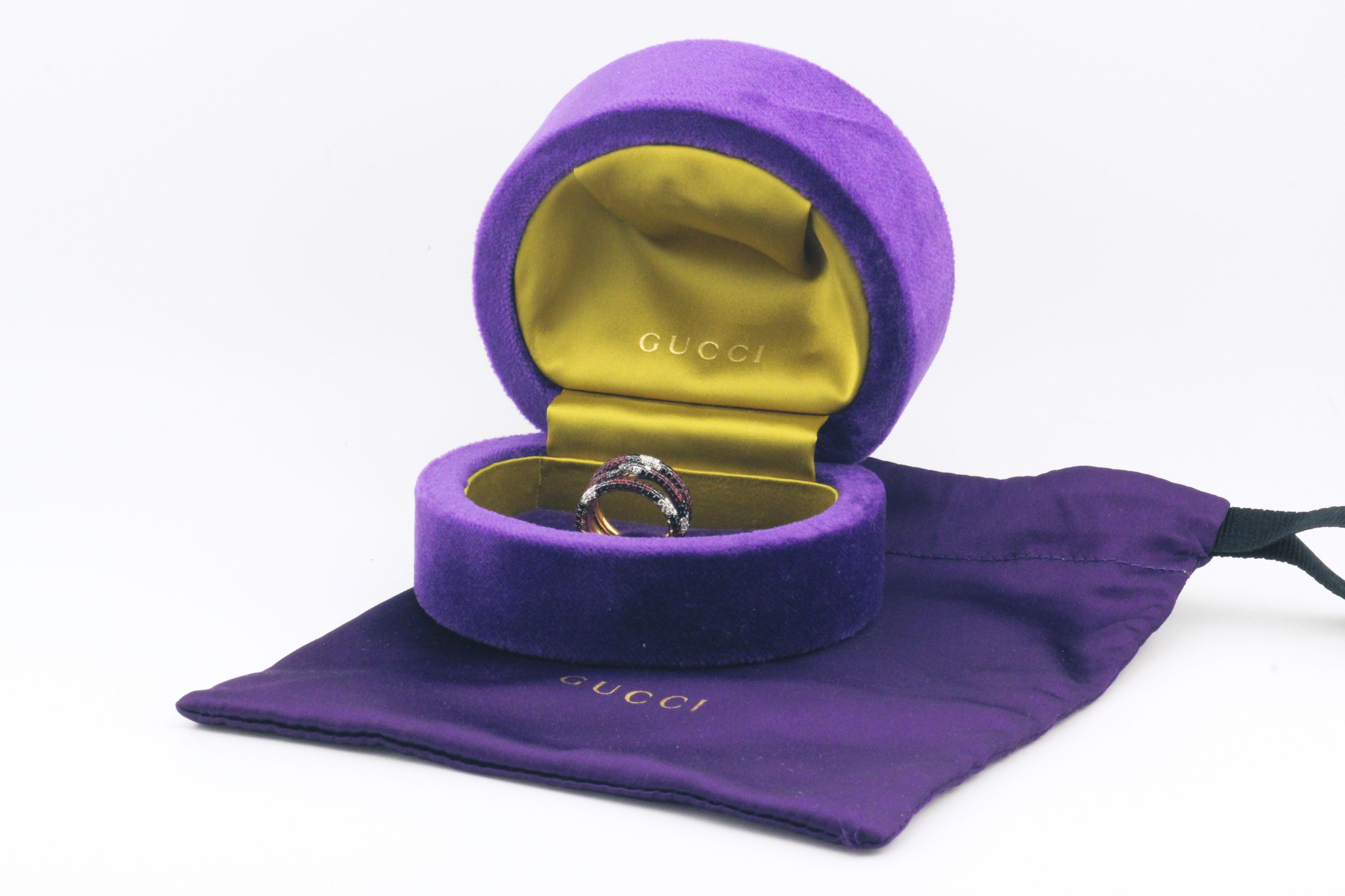 Dive into the enchanting world of Gucci with the Ouroboros Gemstone 18k Yellow Gold Kingsnake Three-Band Ring, a spectacular piece that transcends conventional jewelry, blending symbolism, opulence, and masterful craftsmanship. This captivating