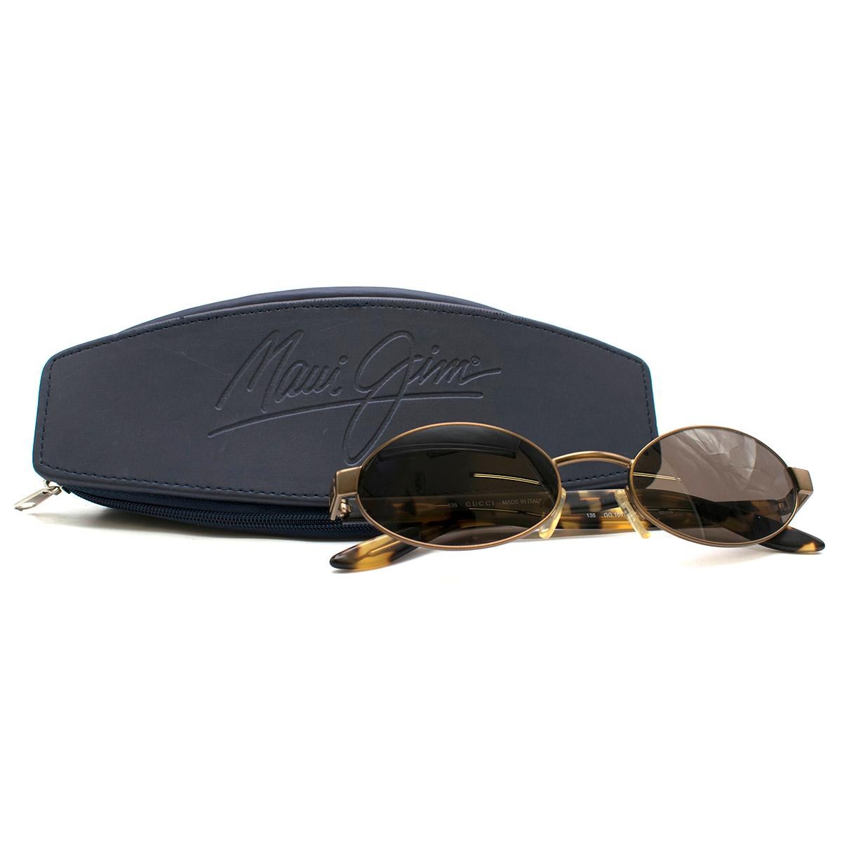  Gucci Oval Tortoise Shell Sunglasses

- Oval Tortoise Shell Sunglasses 
- Bronze-toned metal bridge and frame
- Brand initial motif on side of frame 
- UV lenses and adjustable nose pads
- This item comes with a protective case and cleaning cloth.