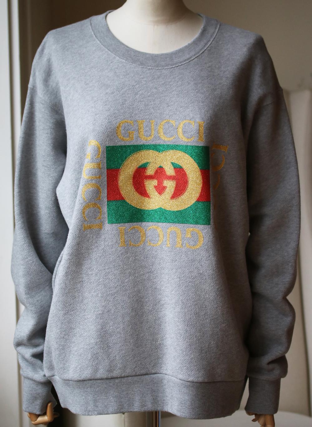 Printed with a glittered version of Gucci's '80s-era emblem, this oversized sweatshirt is cut from soft cotton-terry and turns to reveal an appliquéd tiger at the back. Multicolored cotton-terry. Slips on. 100% cotton. Made in Italy.

Size: Small
