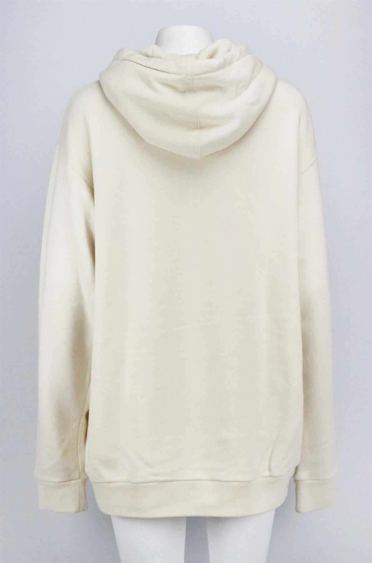 This hoodie by Gucci fits for a oversized silhouette with intricate embellished logo and Geisha detail along the front in pearls and crystals in a soft cotton-terry fabric. Cream cotton. Slips on. 100% Cotton; fabric2: 100% polyester. Size: Large