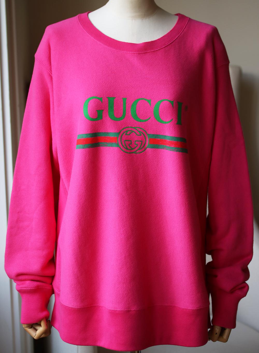 Logos are a key trend for the season and no one does it better than Alessandro Michele. Printed with a green version of Gucci's '80s-era emblem, this oversized sweatshirt is cut from soft cotton-terry. Pink cotton-terry. Slips on. 100% cotton. Made