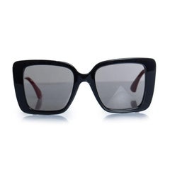 Gucci, oversized sunglasses with webbing