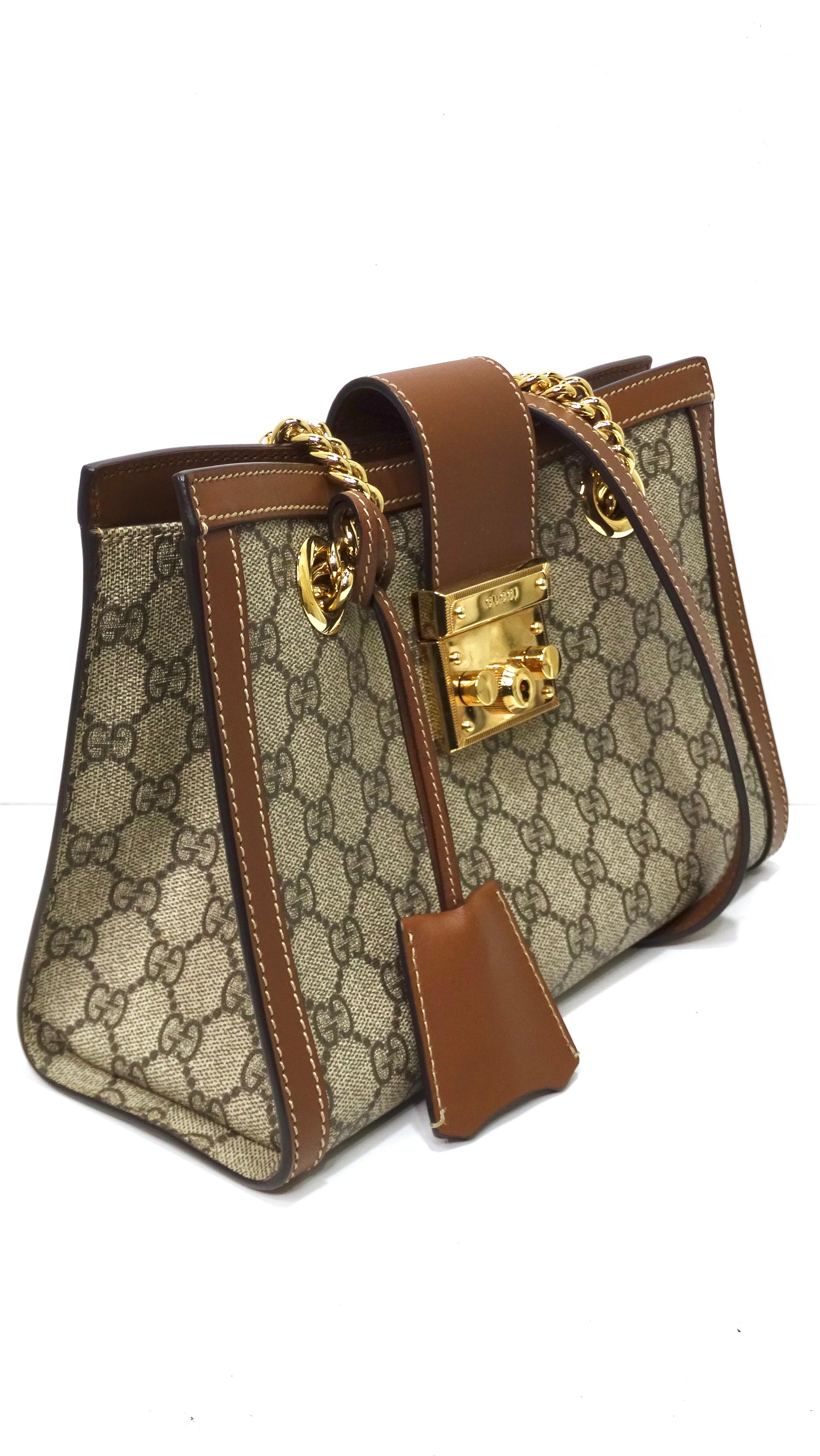 From none other than the house of Gucci! Get your piece of the iconic fashion house today. This takes the classic monogrammed bag and adds an interesting twist. The monogram is classic to the Gucci brand with 'GG' embedded through the whole
