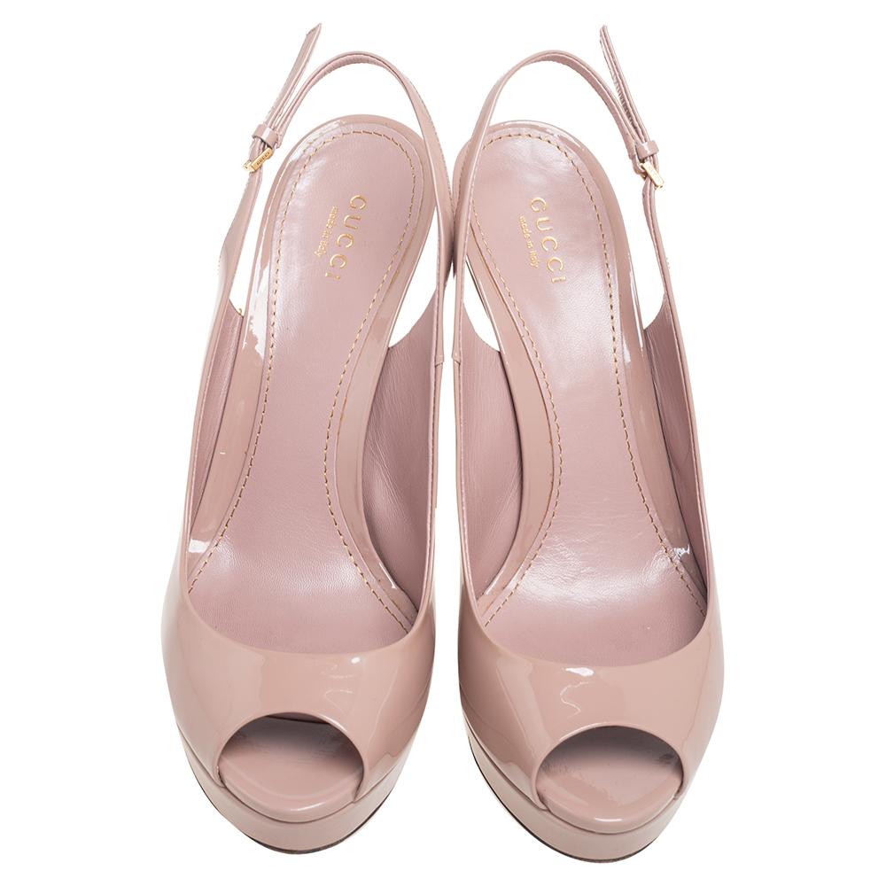 A beautiful pair of Gucci shoes that are easy to wear and yet perfect to dress you up, these sandals are highly versatile. Constructed in pink patent leather, these shoes feature peep toes with a slingback buckled closure and a platform that makes