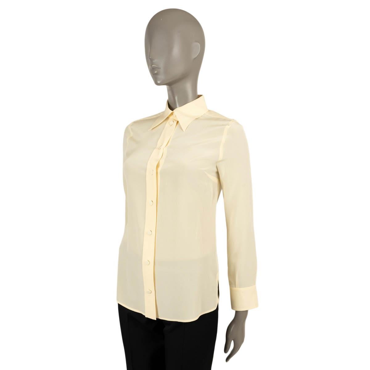 100% authentic Gucci crepe blouse in pale yellow silk (100%). Features GG embroidered at the chest and pointed collar. Closes with fabric covered buttons on the front. Has been worn and is in excellent condition.

2020