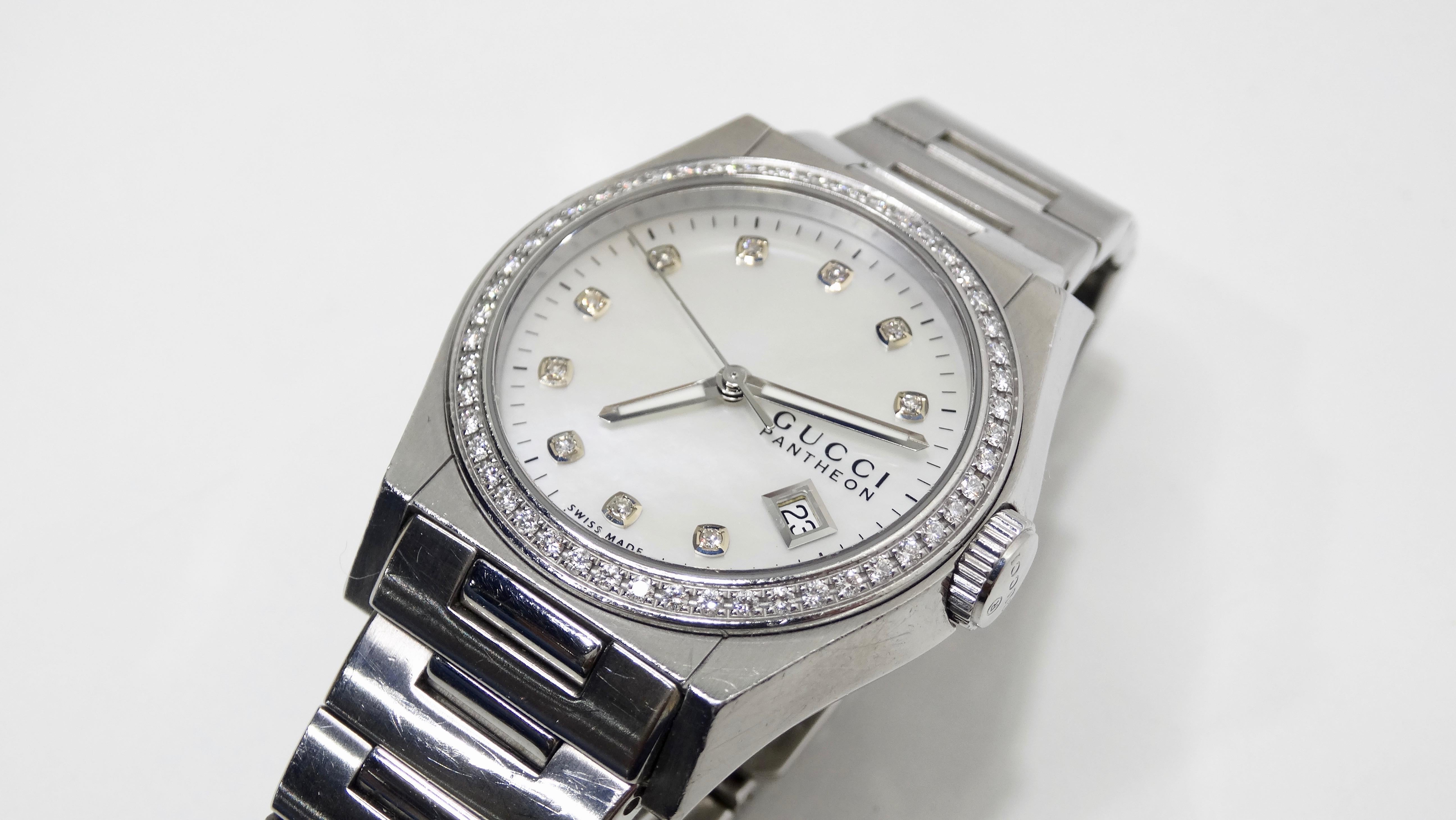 Give yourself some Gucci! Circa 21st Century, this timeless Swiss made Gucci 36mm wrist watch is crafted from Stainless Steel and features a Bezel set with 50 Diamonds (0.71ct), White Mother of Pearl dial with 10 diamond hour markers, a scratch