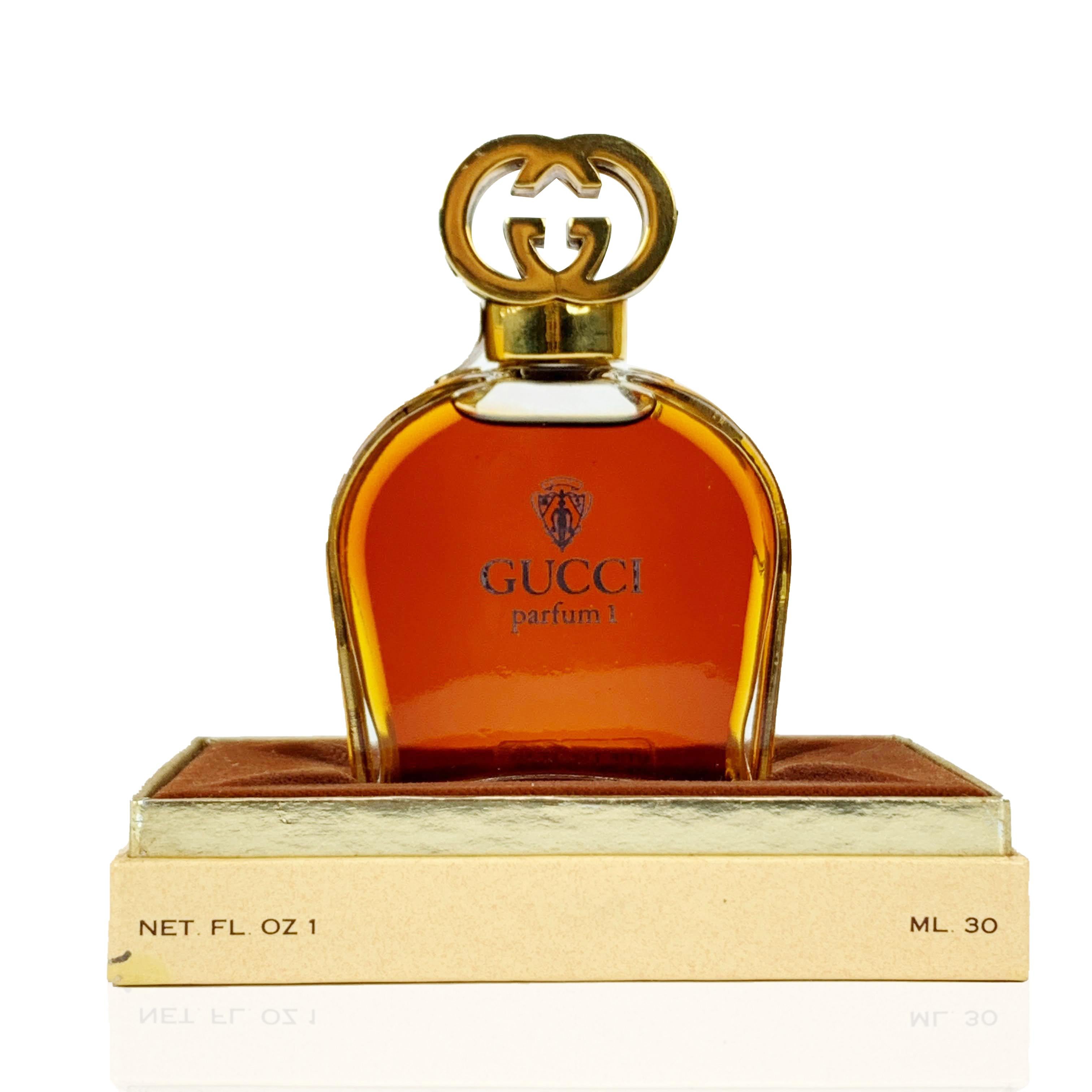 Very rare 'Gucci Parfum 1' 1oz/ 30ml bottle in its original presentation box. The bottle is embellished with iconic green/red/green enamel stripes on the sides. Gold metal GG - GUCCI logo cap. Gucci No 1 Parfum by Gucci is a floral chypre fragrance