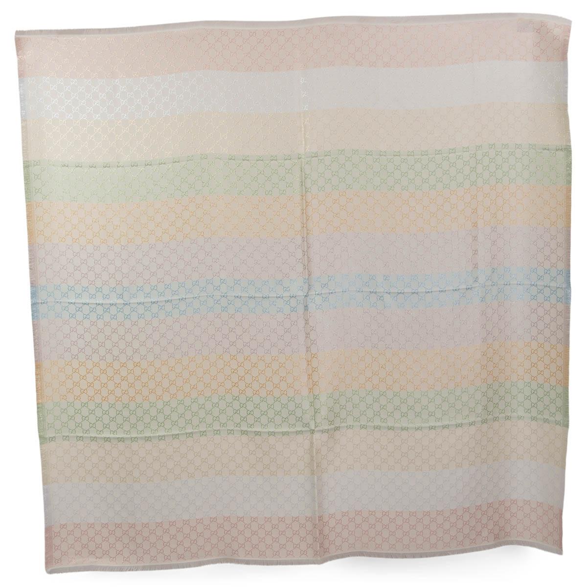 100% authentic Gucci GG Monogram shawl crafted using a jacquard technique and featuring the GG pattern in pastel rainbow, light blue, light pink, yellow, light green, champagne and silver 31% viscose 28% cotton 23% wool 10% silk 8% metallic fiber in