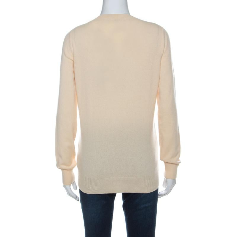 Your winter wardrobe will be offered a classic turn when you add this pretty pastel yellow sweater from Gucci. It's knitted well using luxurious cashmere punctuated with a round neckline and long sleeves. This warmer can be paired up with all types