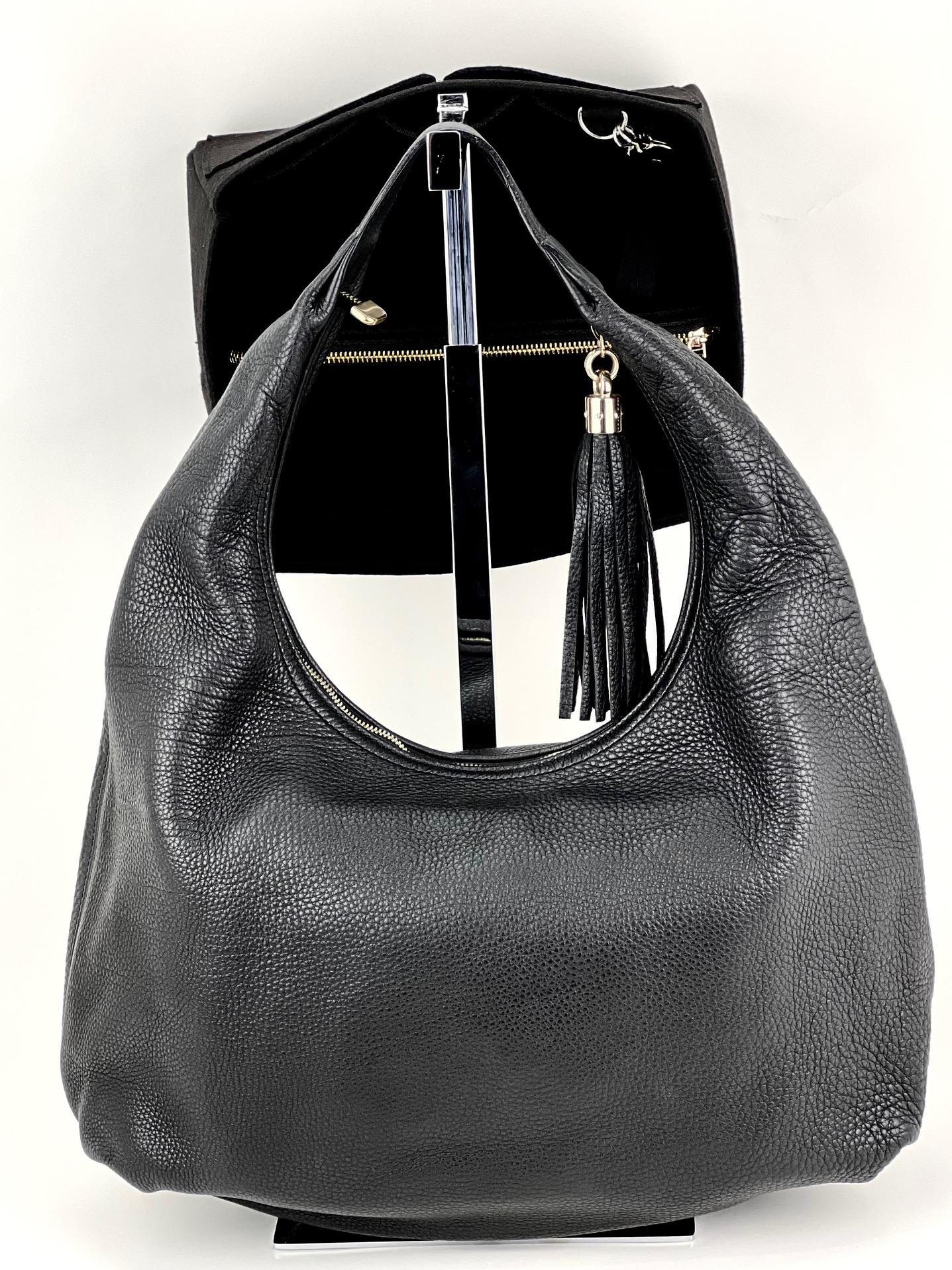Pre-Owned  100% Authentic
GUCCI Large Soho Hobo Black Pebbled Calfskin
Top Handle Tassel Added Insert to help keep shape
and organize
RATING: A...Excellent, near mint, only
slight signs of wear
MATERIAL: Calfskin Leather
HANDLE: single leather