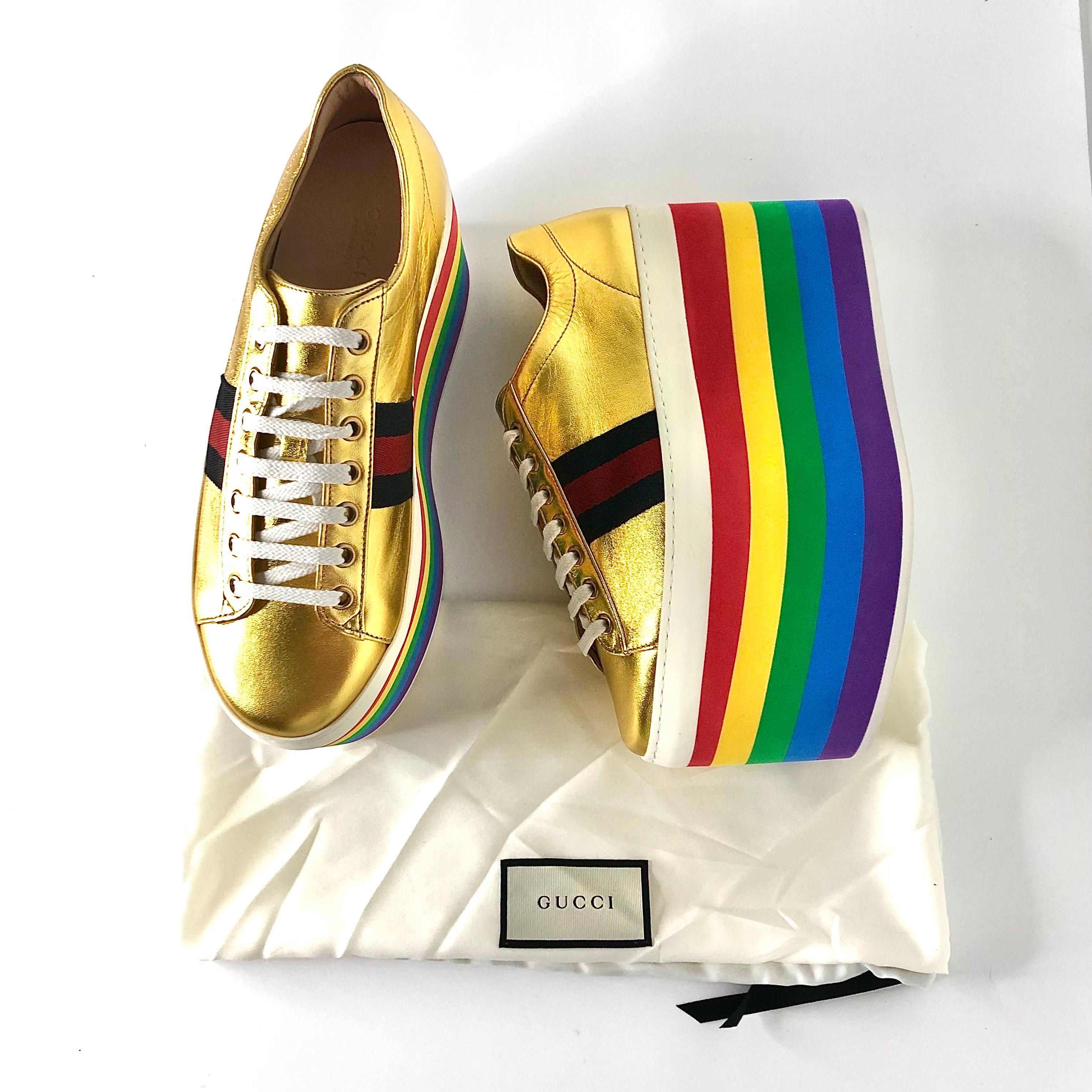 Gucci Peggy Platform Sneakers in Metallic Gold Rainbow
With dustbag, light signs of try on or wear on soles
Color Multi
Size 38.5EU
Leather upper
Rubber platform sole
Low top style
Metallic gold leather 
Web Stripe accent 
Round toe 
White flat
