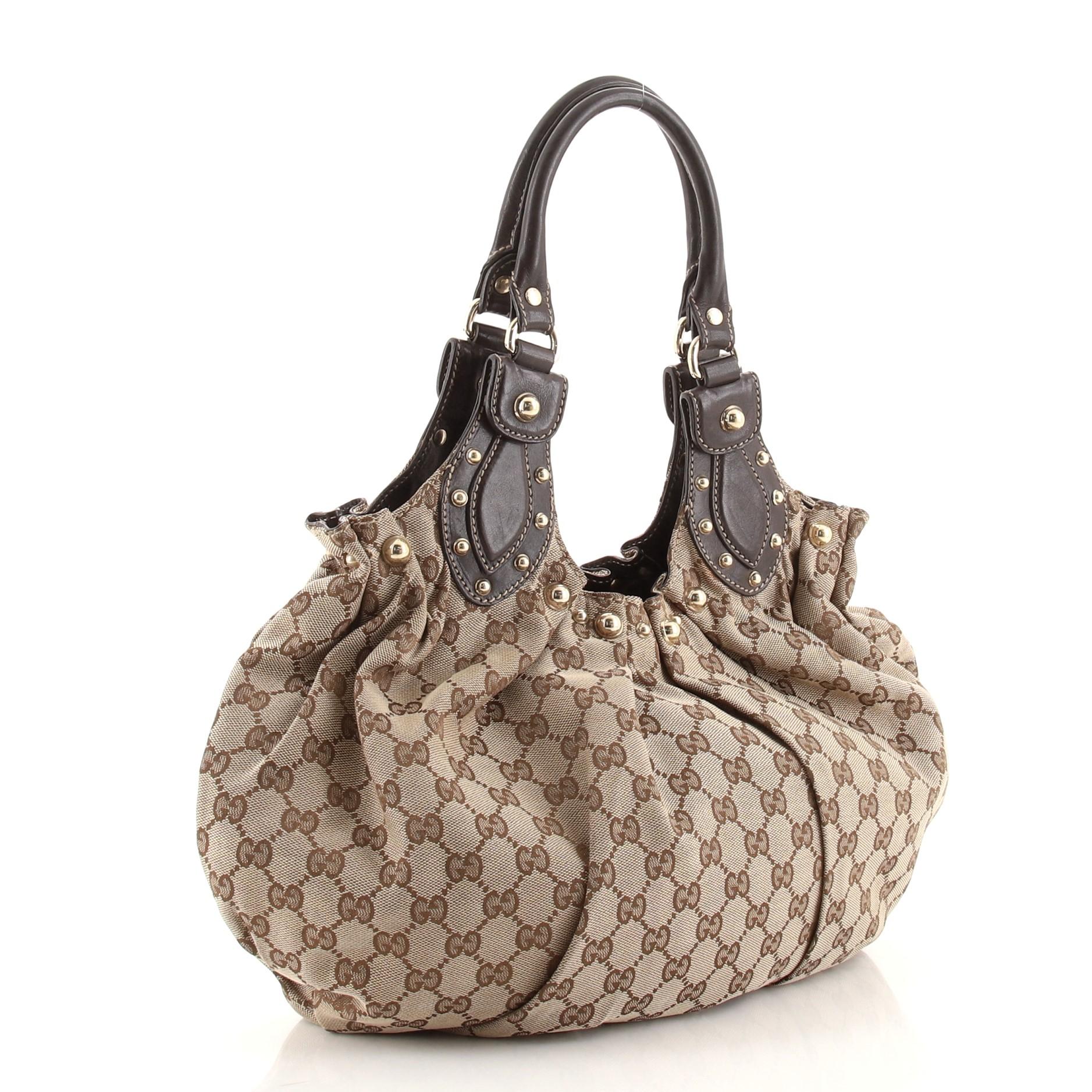Condition: Good. Odor in interior. Wear and stains on exterior, moderate wear, scuffs and indentations on leather trims and handles, splitting, peeling and fraying on handle and handle base trim wax edges. Light wear in interior, scratches,
