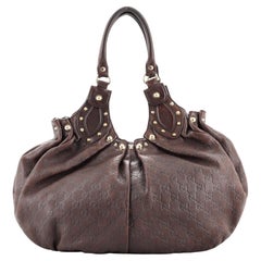 Gucci - Sac à bandoulière Pelham clouté GG Canvas Medium
