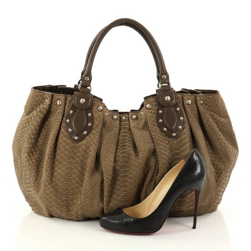 This authentic Gucci Pelham Tote Studded Python Large is perfect for any casual or sophisticated outfit. Crafted from genuine brown python, this tote features dual-rolled top handles, ruched silhouette, studs detailing, and gold-tone hardware