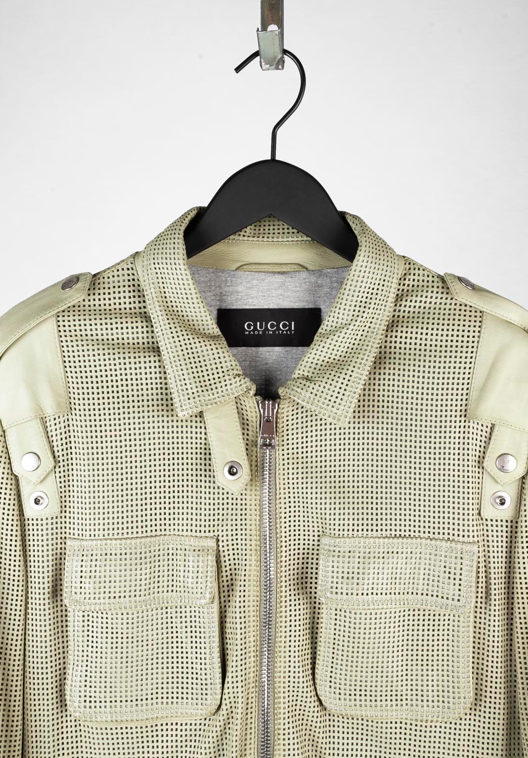 100% genuine Gucci Perforated Leather Jacket 
Color: Pale green
(An actual color may a bit vary due to individual computer screen interpretation)
Material: 100% leather
Tag size: M/L
This jacket is great quality item. Rate 9 of 10, excellent.
Actual