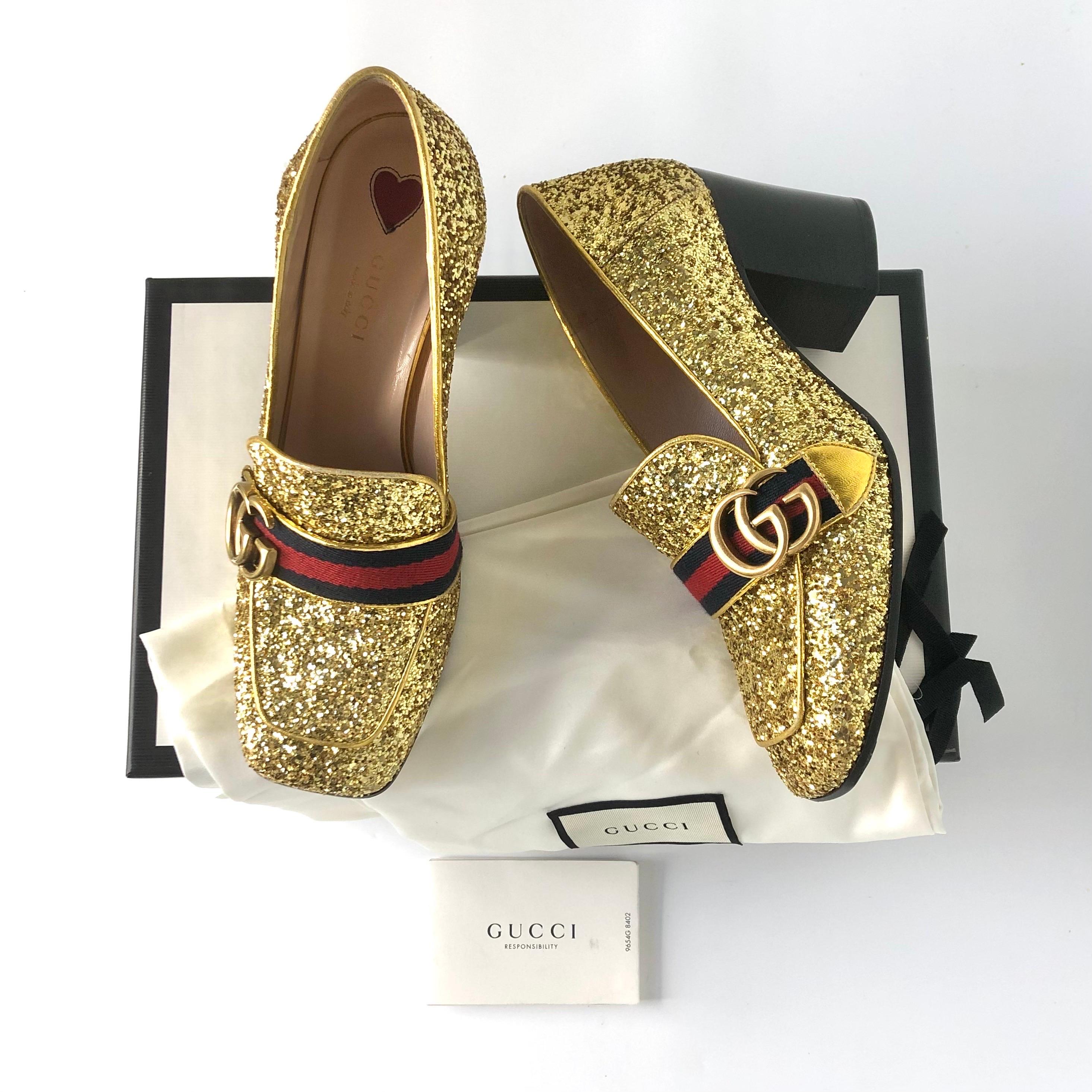 Gucci Peyton Web Stripe 75mm Glitter Loafers
In original box, with dustbags
Color Oro
Size 37.5EU
Leather upper
Leather lined
Double G brass finished hardware
All over gold glitter 
Platform sole
Block heel
Made in Italy 
75mm heel height
Signs of