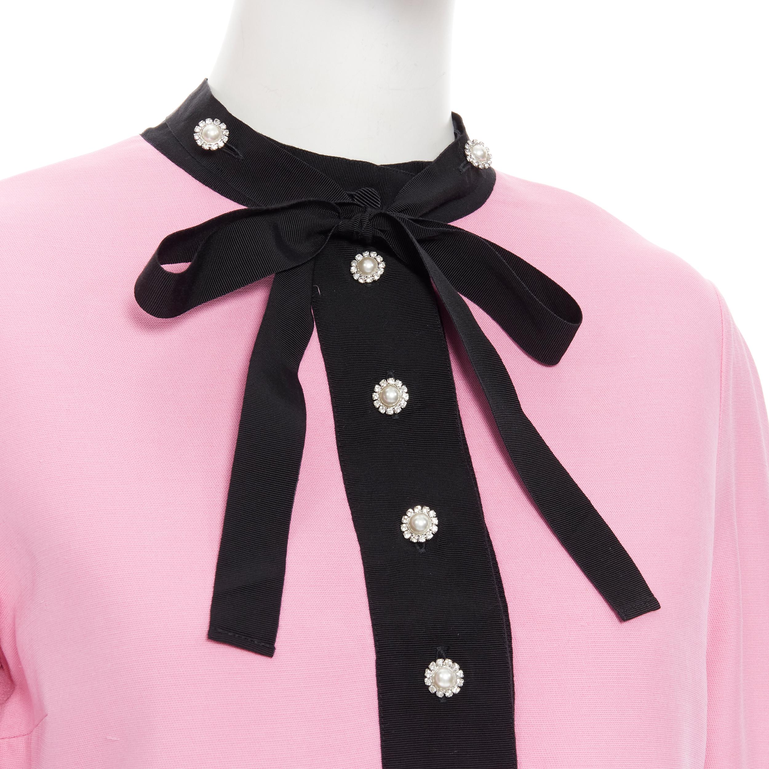 GUCCI pink black pearl crystal buttons bow tie ruffle trim cocktail dress IT42 
Reference: TGAS/B01514 
Brand: Gucci 
Designer: Alessandro Michele 
Material: Wool 
Color: Pink 
Pattern: Solid 
Closure: Zip 
Extra Detail: Faux pearl and crystal